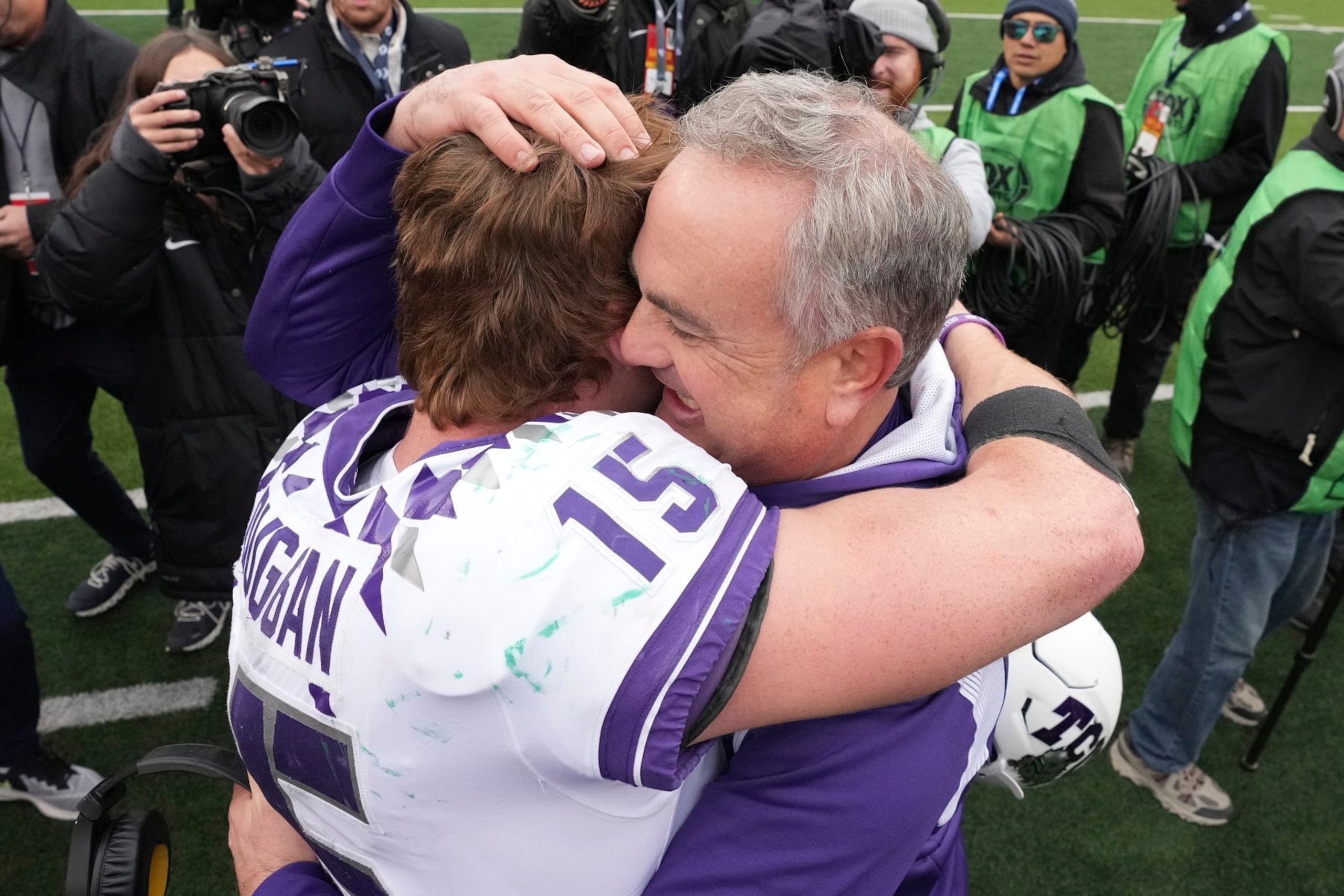 TCU head coach Sonny Dykes hugs quarterback Max Duggan (15) after an NCAA college football game against Bayor in Waco, Texas, Saturday, Nov. 19, 2022. TCU won 29-28. (AP Photo/LM Otero) TCU head coach Sonny Dykes hugs quarterback Max Duggan (15) after an NCAA college football game against Bayor in Waco, Texas, Saturday, Nov. 19, 2022. TCU won 29-28. (AP Photo/LM Otero)
