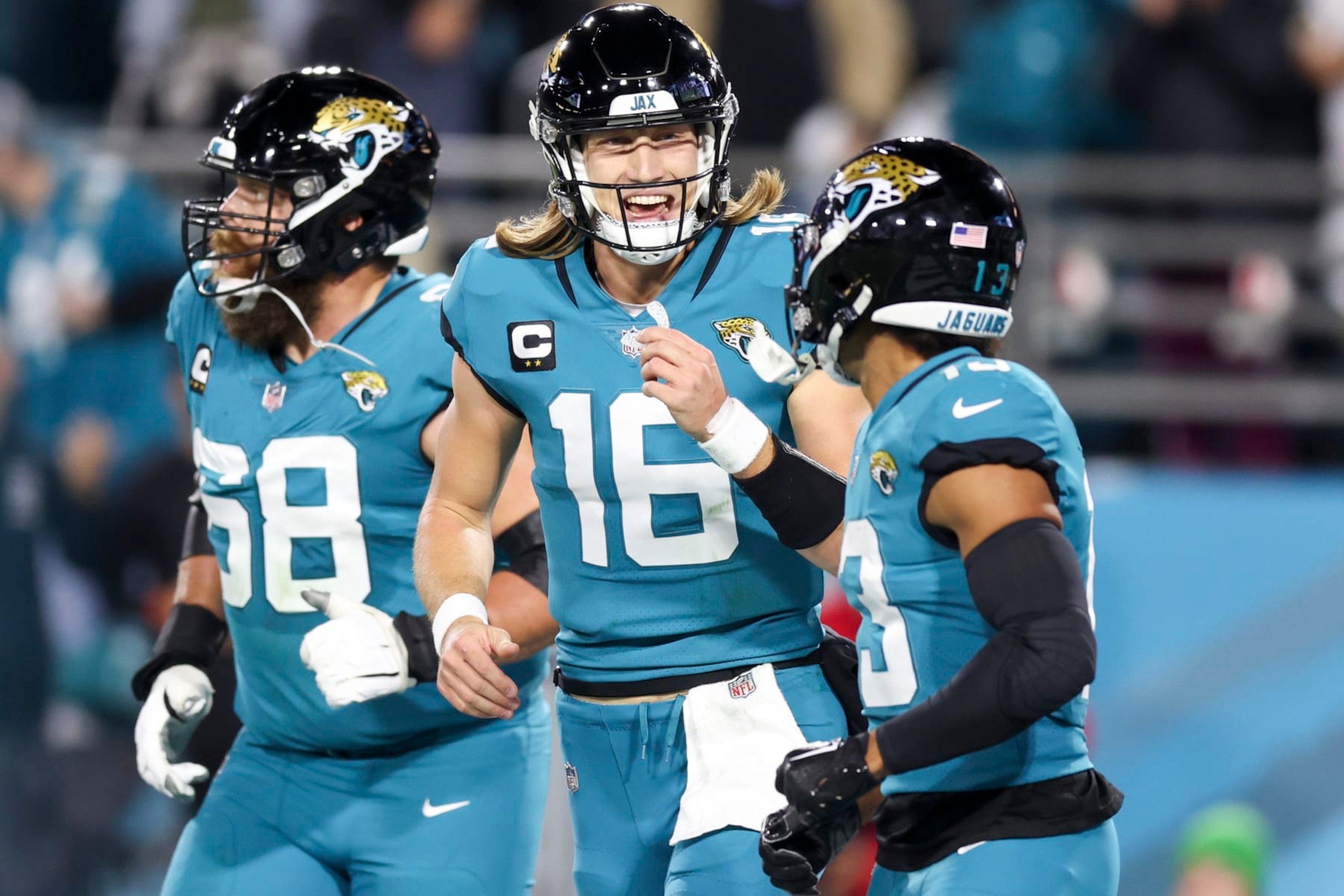 JACKSONVILLE, FLORIDA - JANUARY 07: Trevor Lawrence #16 of the Jacksonville Jaguars celebrates with Christian Kirk #13 of the Jacksonville Jaguars after Kirk's receiving touchdown during the second quarter against the Tennessee Titans at TIAA Bank Field on January 07, 2023 in Jacksonville, Florida. (Photo by Mike Carlson/Getty Images)