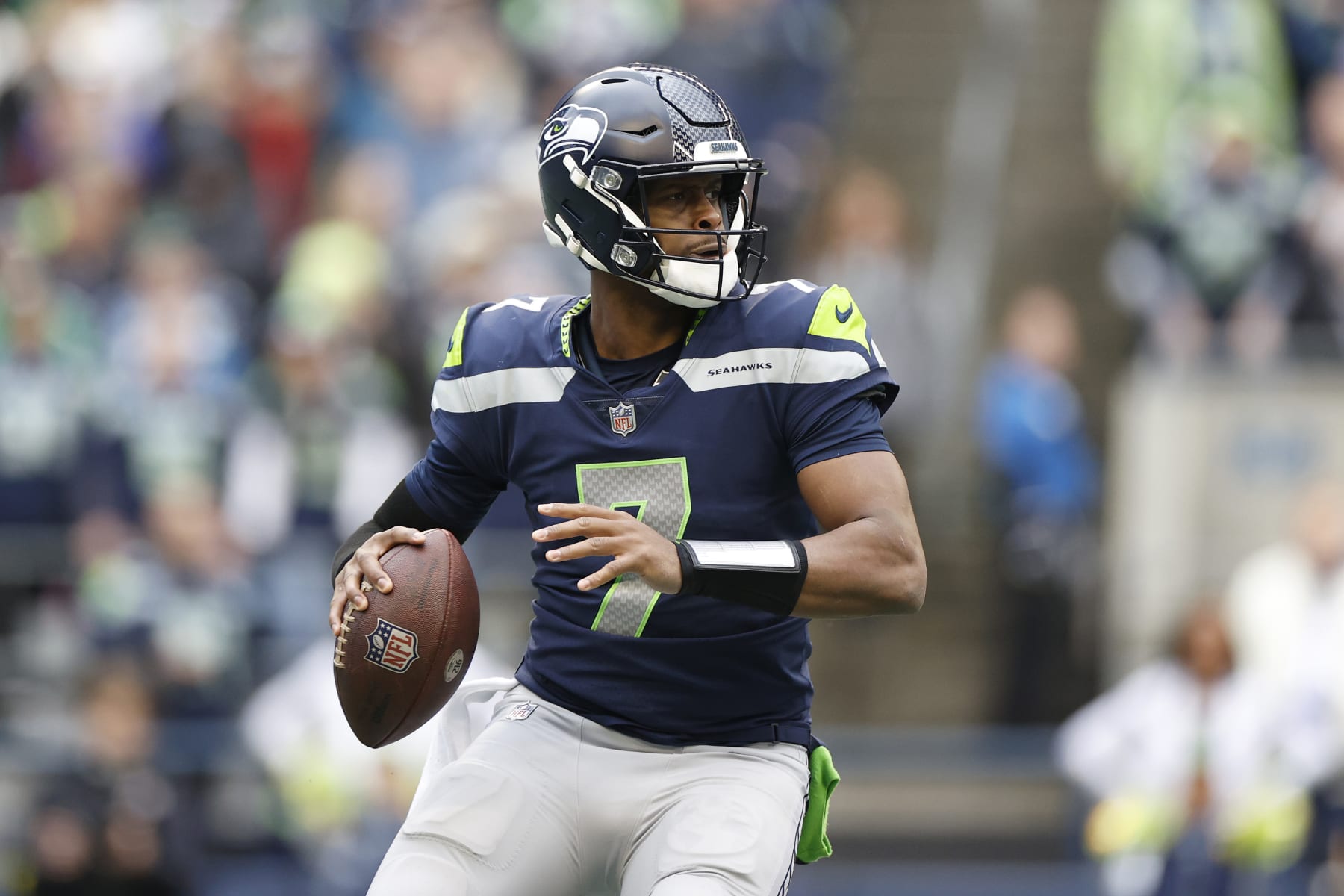 SEATTLE, WASHINGTON - JANUARY 01: Geno Smith #7 of the Seattle Seahawks looks to pass during the second quarter in the game against the New York Jets at Lumen Field on January 01, 2023 in Seattle, Washington. (Photo by Steph Chambers/Getty Images)