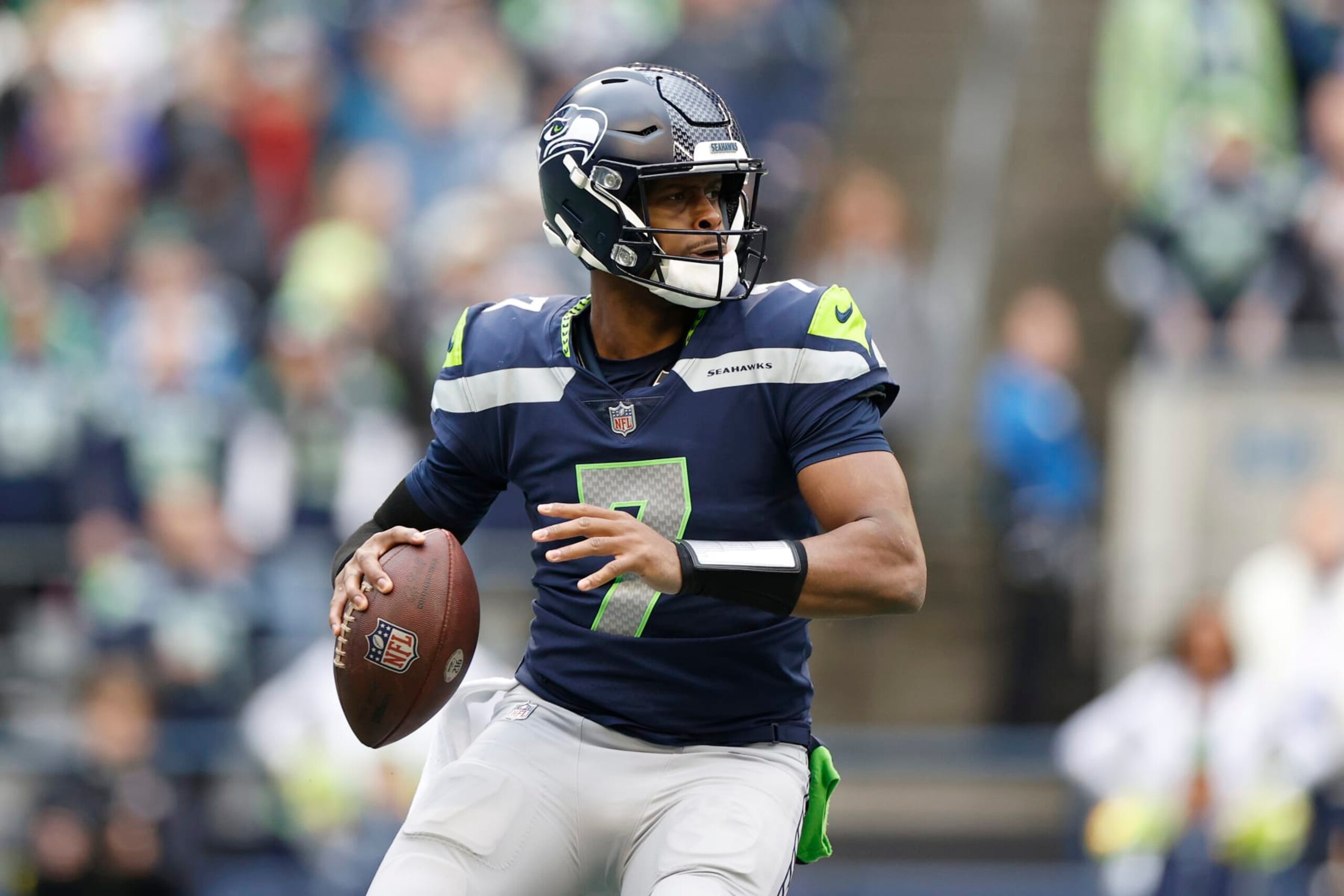SEATTLE, WASHINGTON - JANUARY 01: Geno Smith #7 of the Seattle Seahawks looks to pass during the second quarter in the game against the New York Jets at Lumen Field on January 01, 2023 in Seattle, Washington. (Photo by Steph Chambers/Getty Images)
