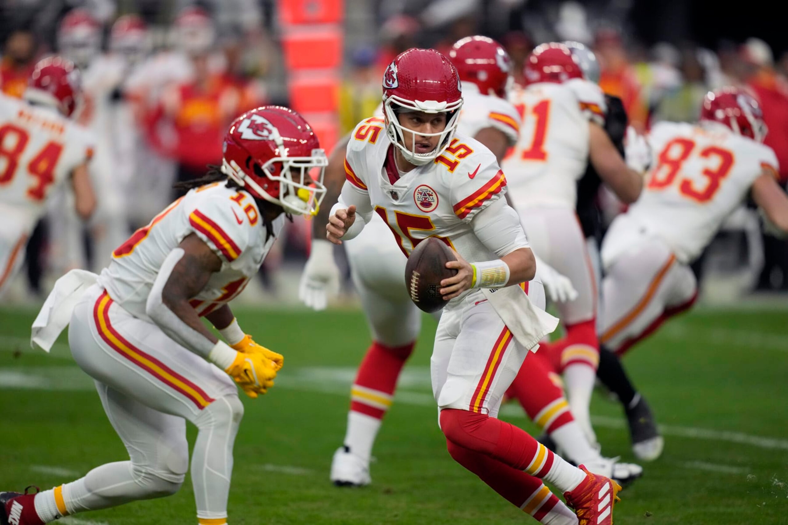 Kansas City Chiefs quarterback Patrick Mahomes (15) drops back to pass during the first half of an NFL football game against the Las Vegas Raiders Saturday, Jan. 7, 2023, in Las Vegas. (AP Photo/John Locher)