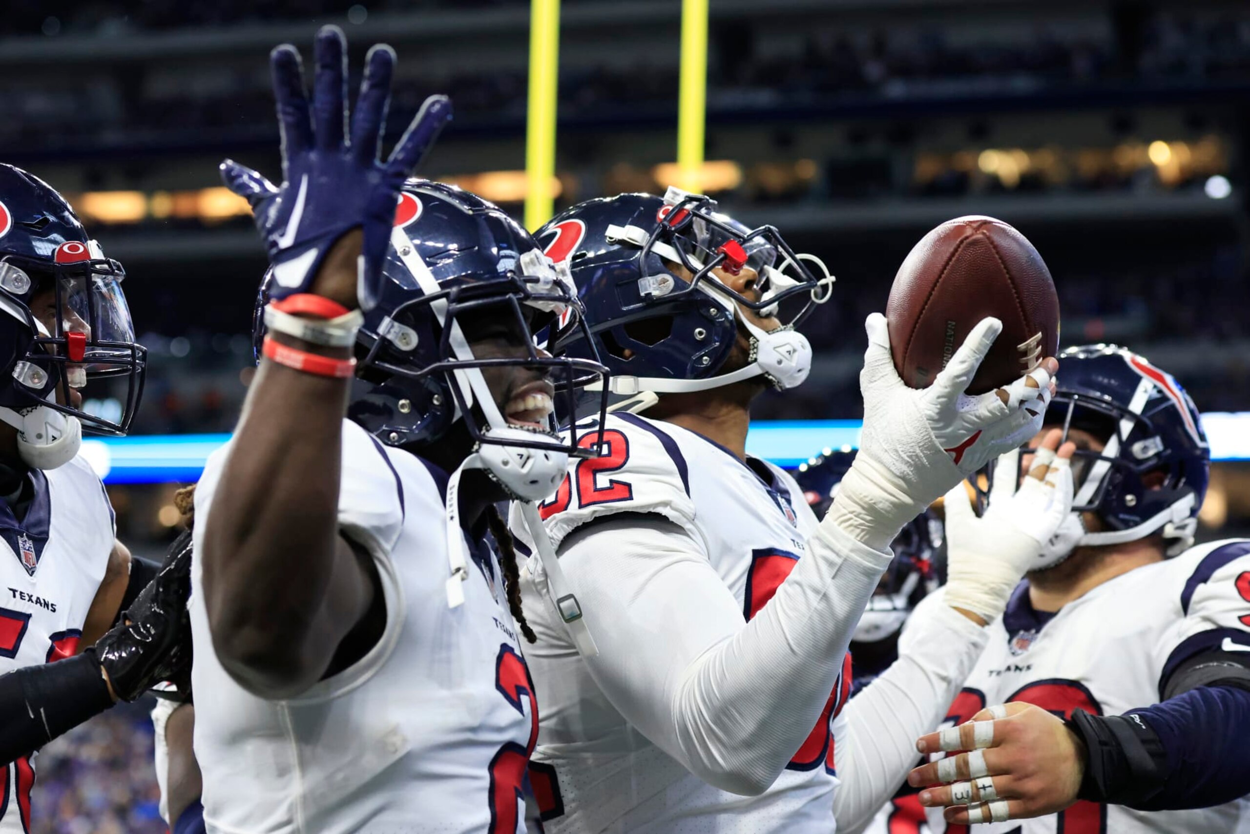 INDIANAPOLIS, INDIANA - JANUARY 08:  Defensive tackle Thomas Booker IV #56 of the Houston Texans celebrates after an interception returned for a touchdown during the game against the Indianapolis Colts at Lucas Oil Stadium on January 08, 2023 in Indianapolis, Indiana. (Photo by Justin Casterline/Getty Images)
