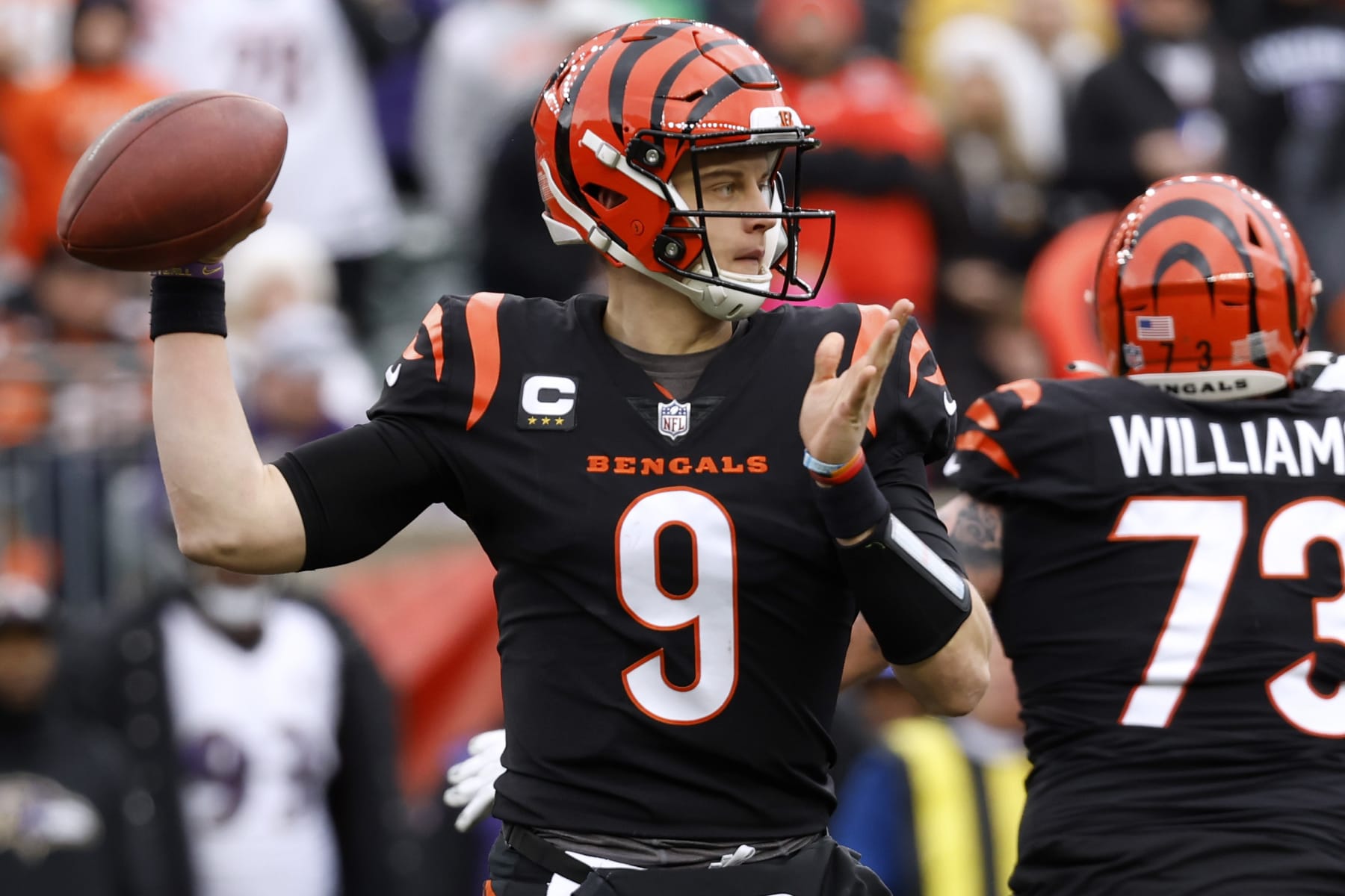 CINCINNATI, OHIO - JANUARY 08: Joe Burrow #9 of the Cincinnati Bengals throws the ball during the first half against the Baltimore Ravens at Paycor Stadium on January 08, 2023 in Cincinnati, Ohio. (Photo by Kirk Irwin/Getty Images)