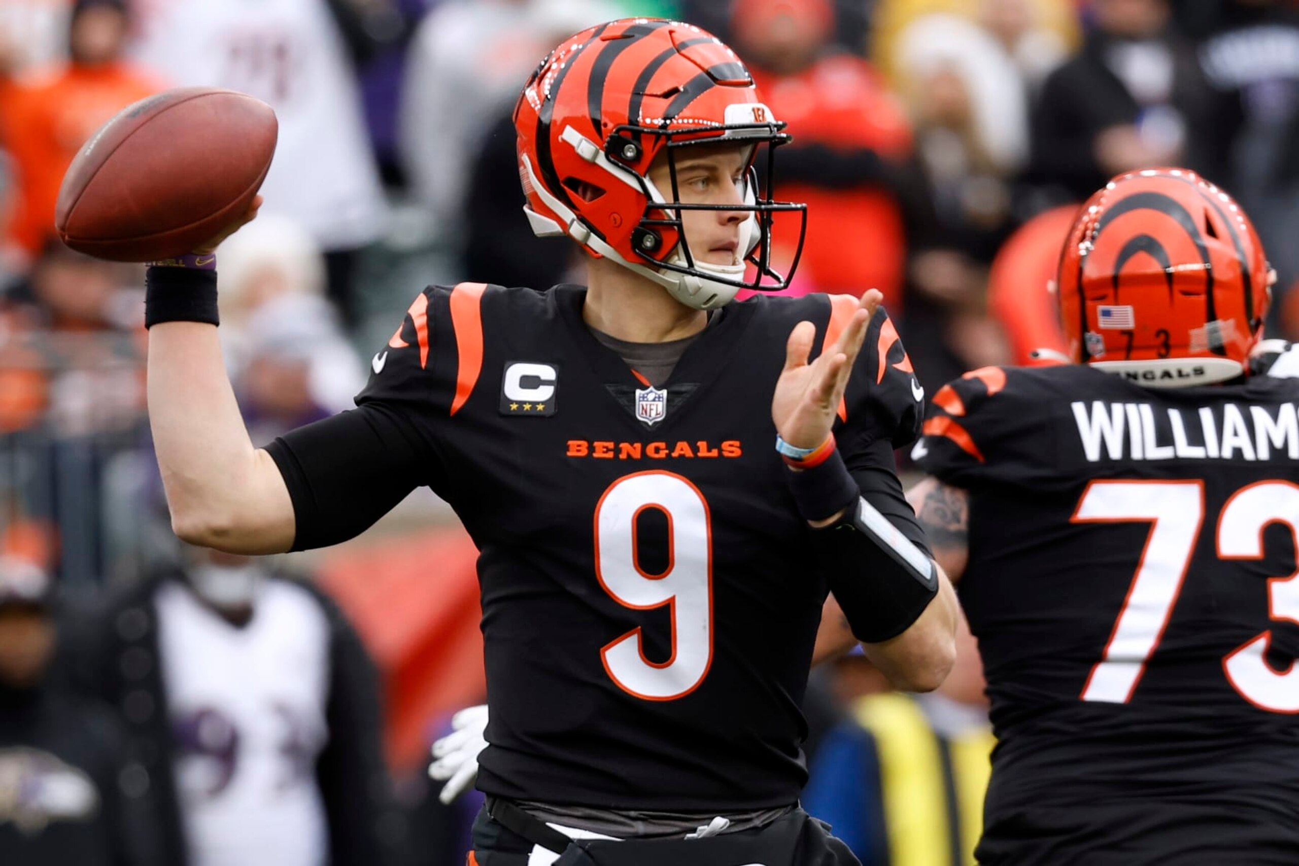CINCINNATI, OHIO - JANUARY 08: Joe Burrow #9 of the Cincinnati Bengals throws the ball during the first half against the Baltimore Ravens at Paycor Stadium on January 08, 2023 in Cincinnati, Ohio. (Photo by Kirk Irwin/Getty Images)
