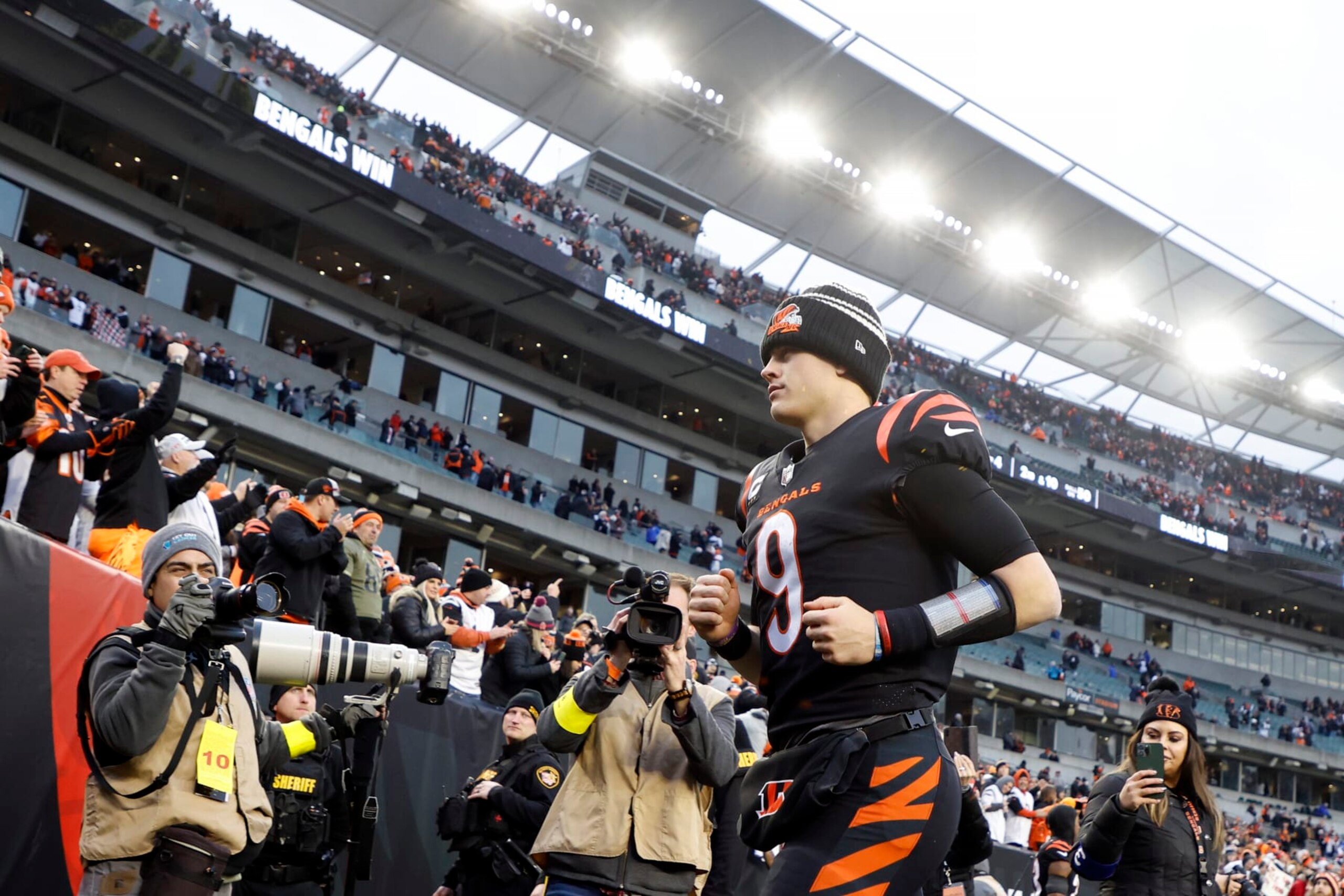 CINCINNATI, OHIO - JANUARY 08: Joe Burrow #9 of the Cincinnati Bengals runs off the field after defeating the Baltimore Ravens 27-16 at Paycor Stadium on January 08, 2023 in Cincinnati, Ohio. (Photo by Kirk Irwin/Getty Images)