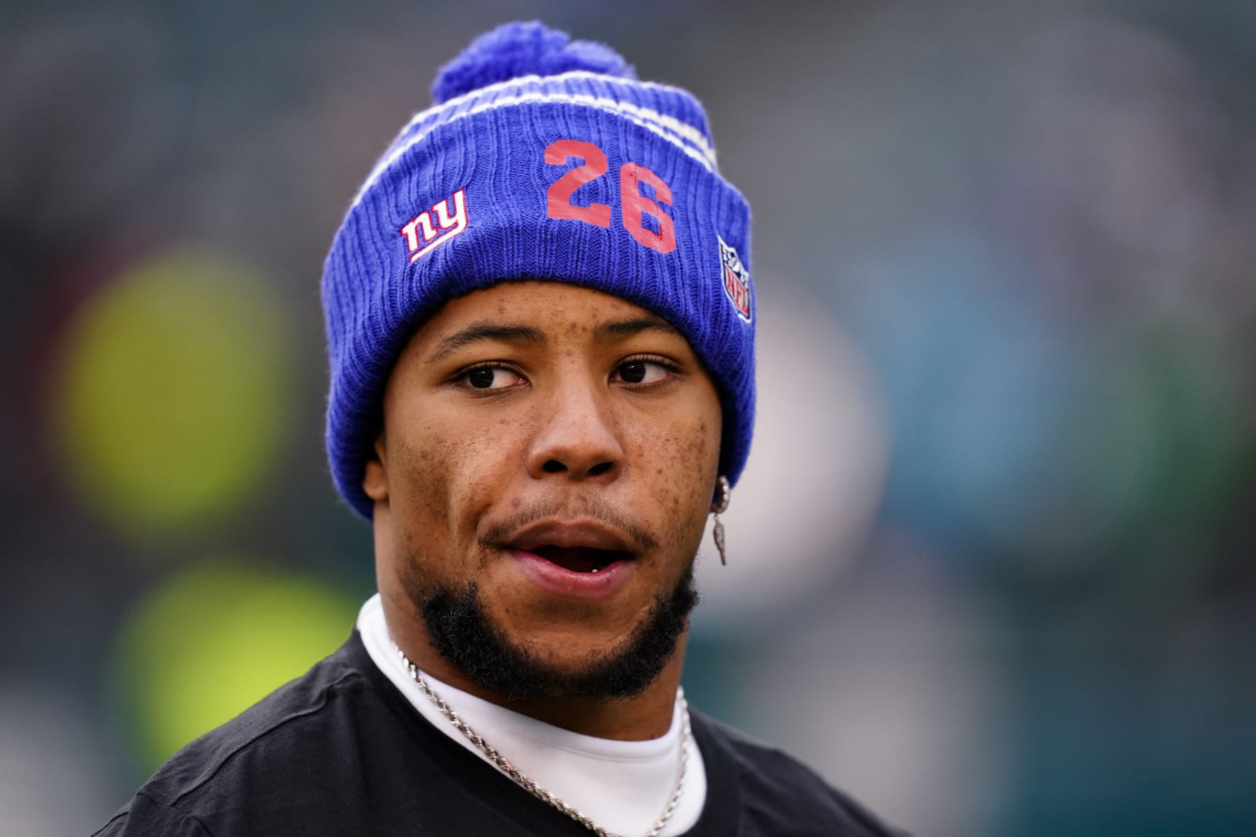 New York Giants running back Saquon Barkley looks on during warmups prior to an NFL football game against the Philadelphia Eagles, Sunday, Jan. 8, 2023, in Philadelphia. (AP Photo/Chris Szagola)
