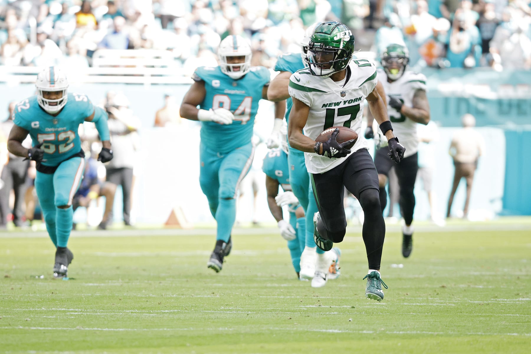MIAMI GARDENS, FLORIDA - JANUARY 08: Garrett Wilson #17 of the New York Jets runs upfield during the second quarter against the Miami Dolphins at Hard Rock Stadium on January 08, 2023 in Miami Gardens, Florida. (Photo by Cliff Hawkins/Getty Images)