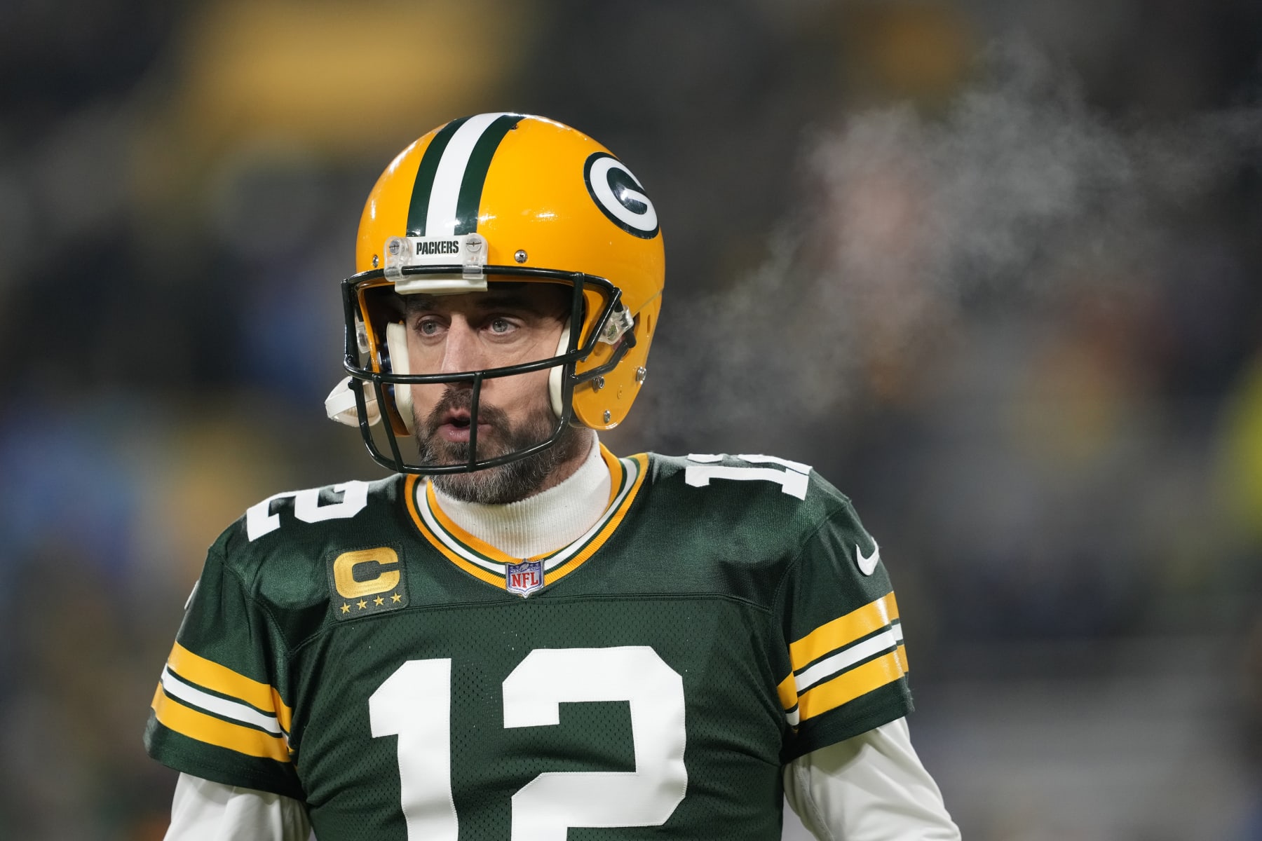GREEN BAY, WISCONSIN - JANUARY 08: Aaron Rodgers #12 of the Green Bay Packers warms up prior to the game against the Detroit Lions at Lambeau Field on January 08, 2023 in Green Bay, Wisconsin. (Photo by Patrick McDermott/Getty Images)