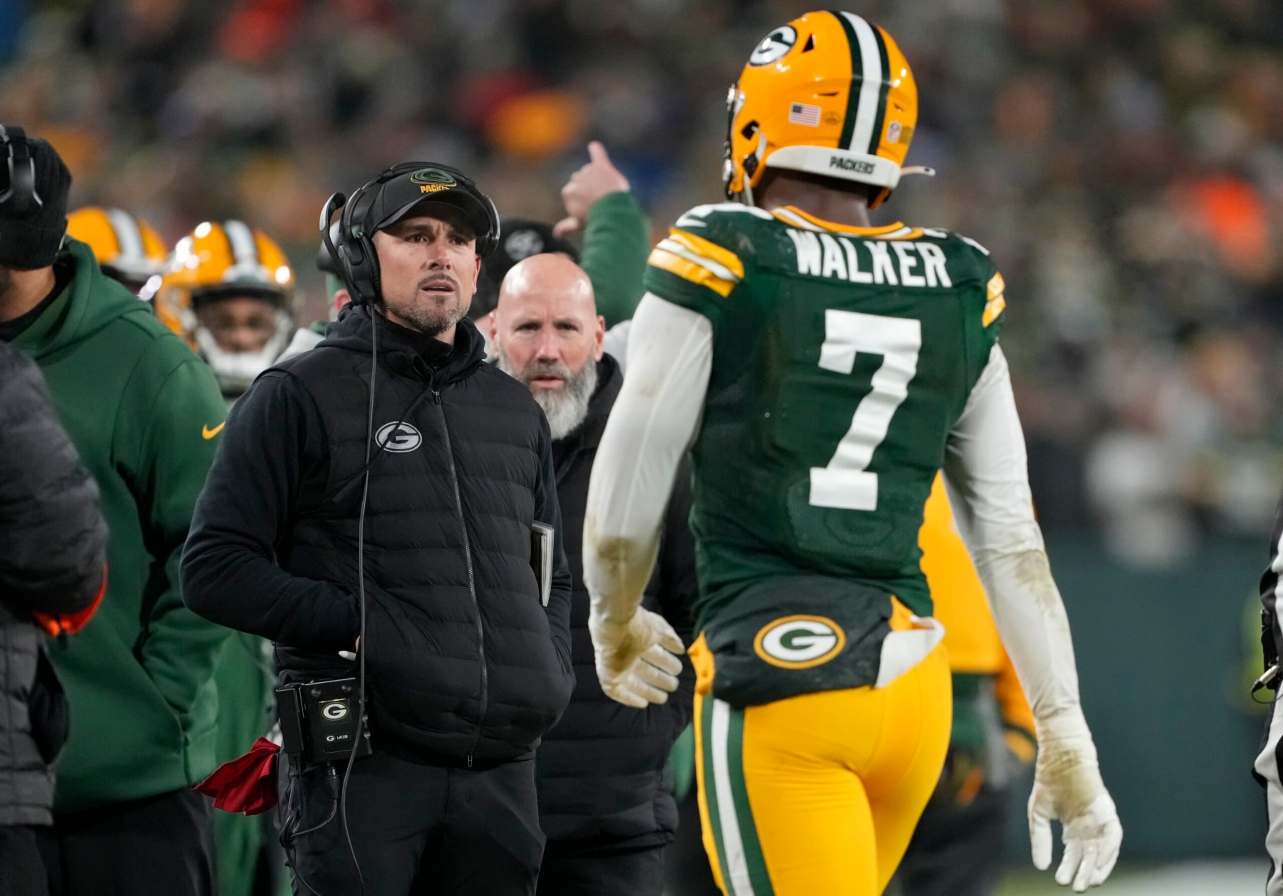 GREEN BAY, WISCONSIN - JANUARY 08: Head coach Matt LaFleur of the Green Bay Packers talks with Quay Walker #7 after he was disqualified for an unsportsmanlike penalty during the fourth quarter against the Detroit Lions at Lambeau Field on January 08, 2023 in Green Bay, Wisconsin. (Photo by Patrick McDermott/Getty Images)