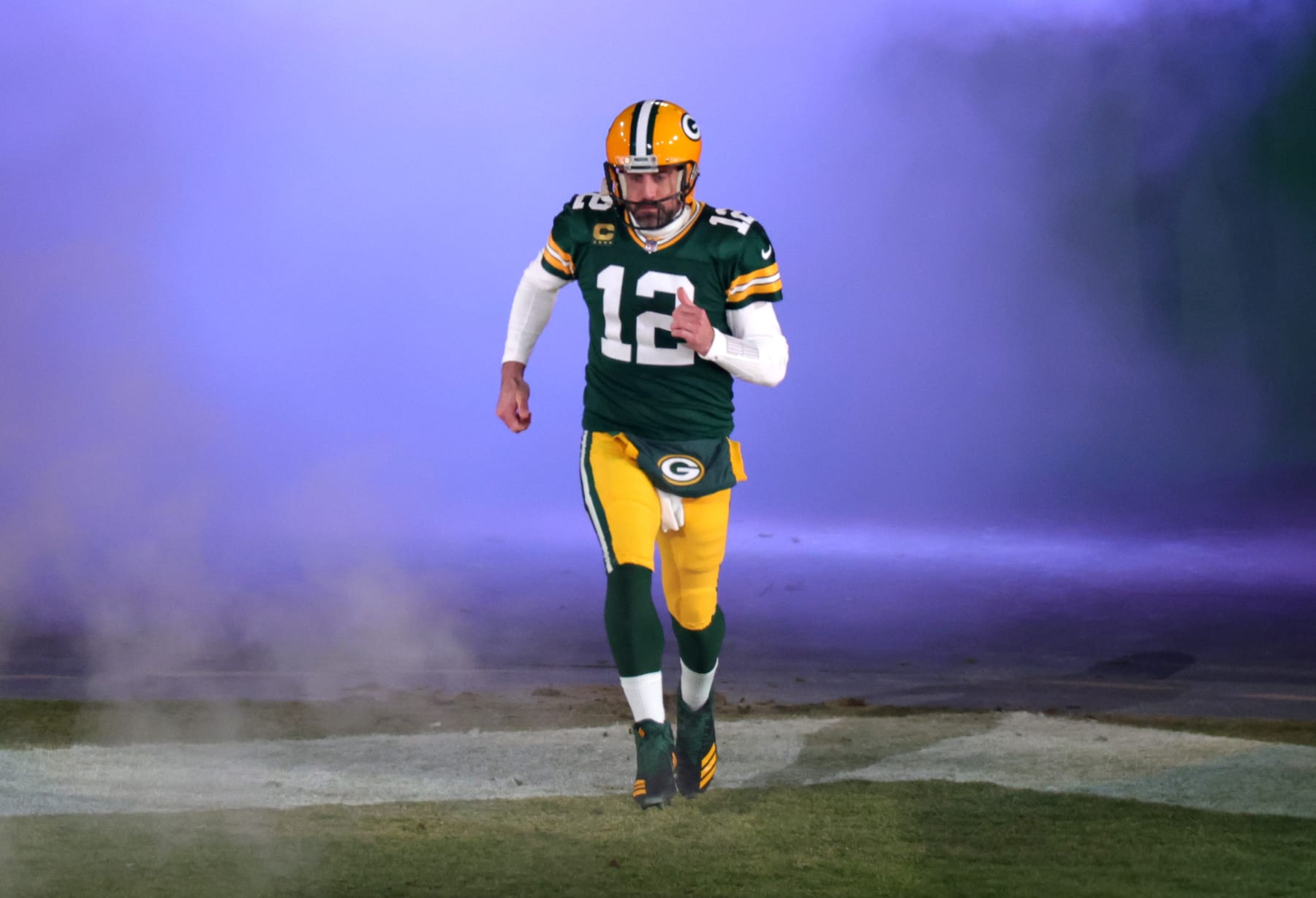 GREEN BAY, WISCONSIN - JANUARY 08: Aaron Rodgers #12 of the Green Bay Packers takes the field prior to the game against the Detroit Lions at Lambeau Field on January 08, 2023 in Green Bay, Wisconsin. (Photo by Stacy Revere/Getty Images)