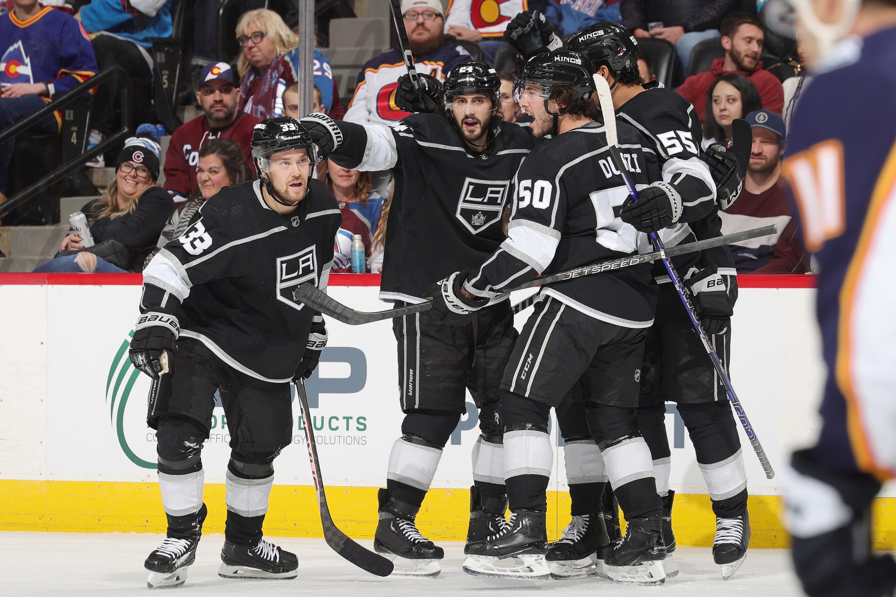 DENVER, COLORADO - DECEMBER 29: Phillip Danault #24 of the Los Angeles Kings celebrates a goal against the Colorado Avalanche with teammates, Viktor Arvidsson #33, Sean Durzi #50 and Quinton Byfield #55 at Ball Arena on December 29, 2022 in Denver, Colorado. (Photo by Michael Martin/NHLI via Getty Images)