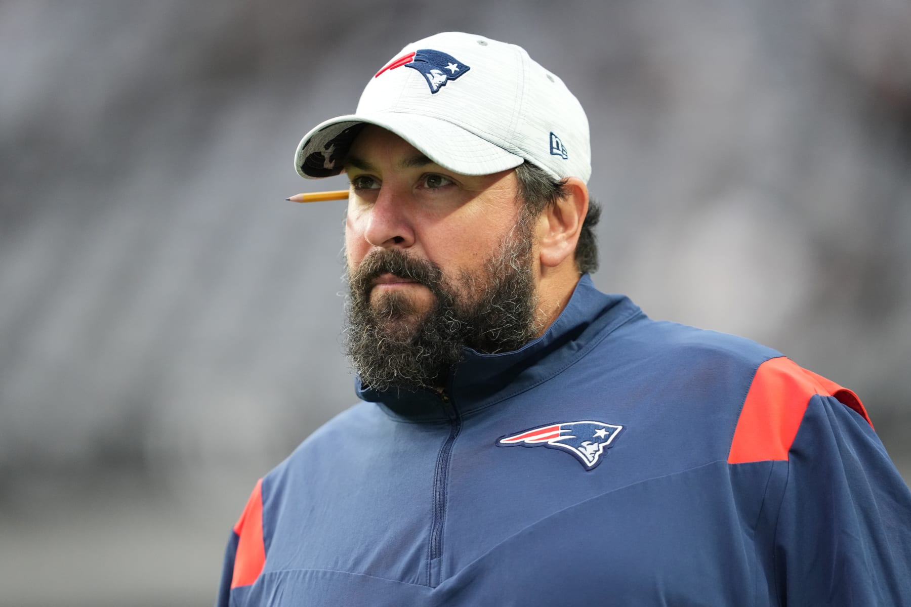 LAS VEGAS, NEVADA - AUGUST 26: Senior football advisor Matt Patricia of the New England Patriots walks onto the field during warmups before a preseason game against the Las Vegas Raiders at Allegiant Stadium on August 26, 2022 in Las Vegas, Nevada. (Photo by Chris Unger/Getty Images)