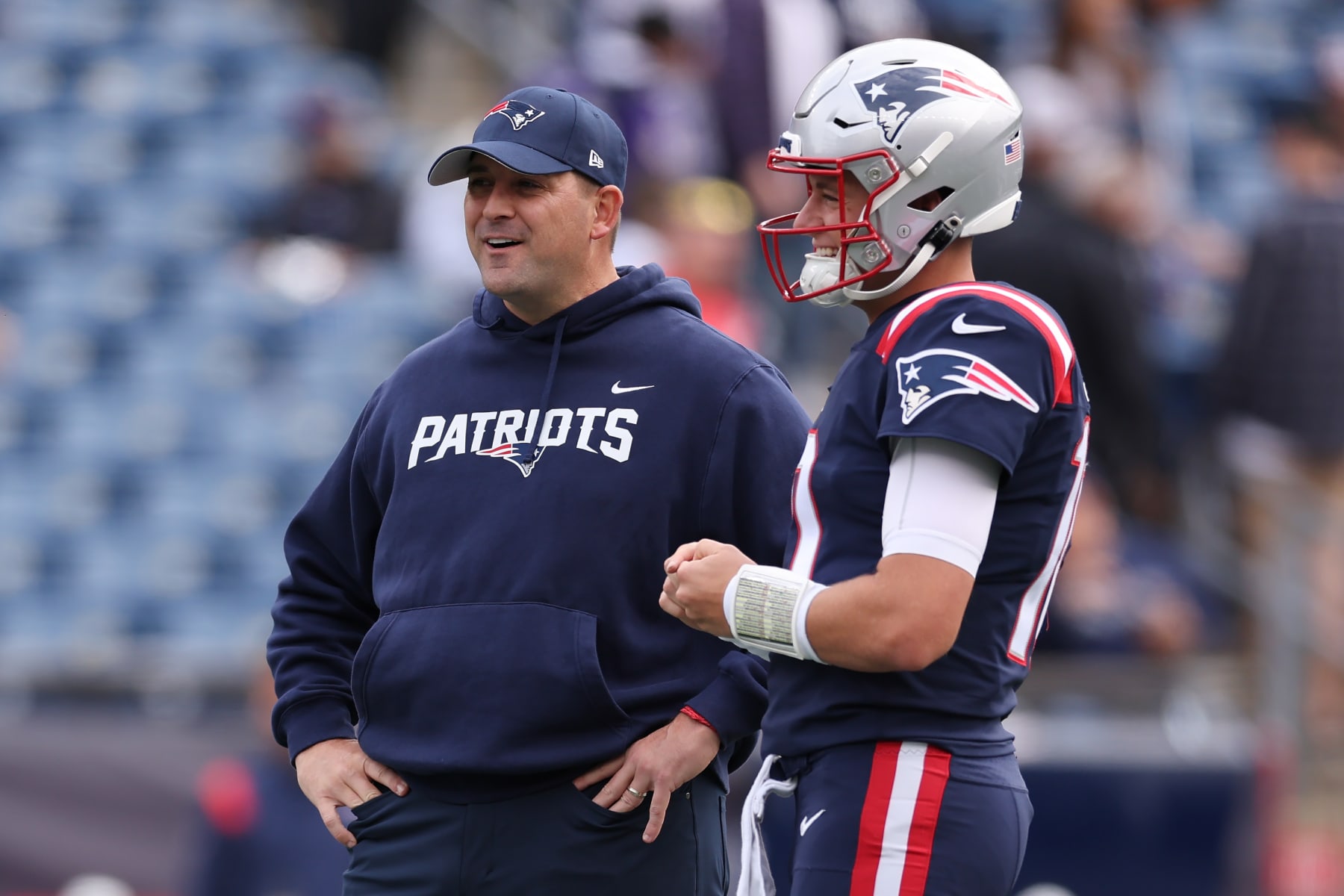 FOXBOROUGH, MASSACHUSETTS - SEPTEMBER 25: Mac Jones #10 of the New England Patriots talks with Quarterbacks coach Joe Judge before the game against the Baltimore Ravens  at Gillette Stadium on September 25, 2022 in Foxborough, Massachusetts. (Photo by Maddie Meyer/Getty Images)
