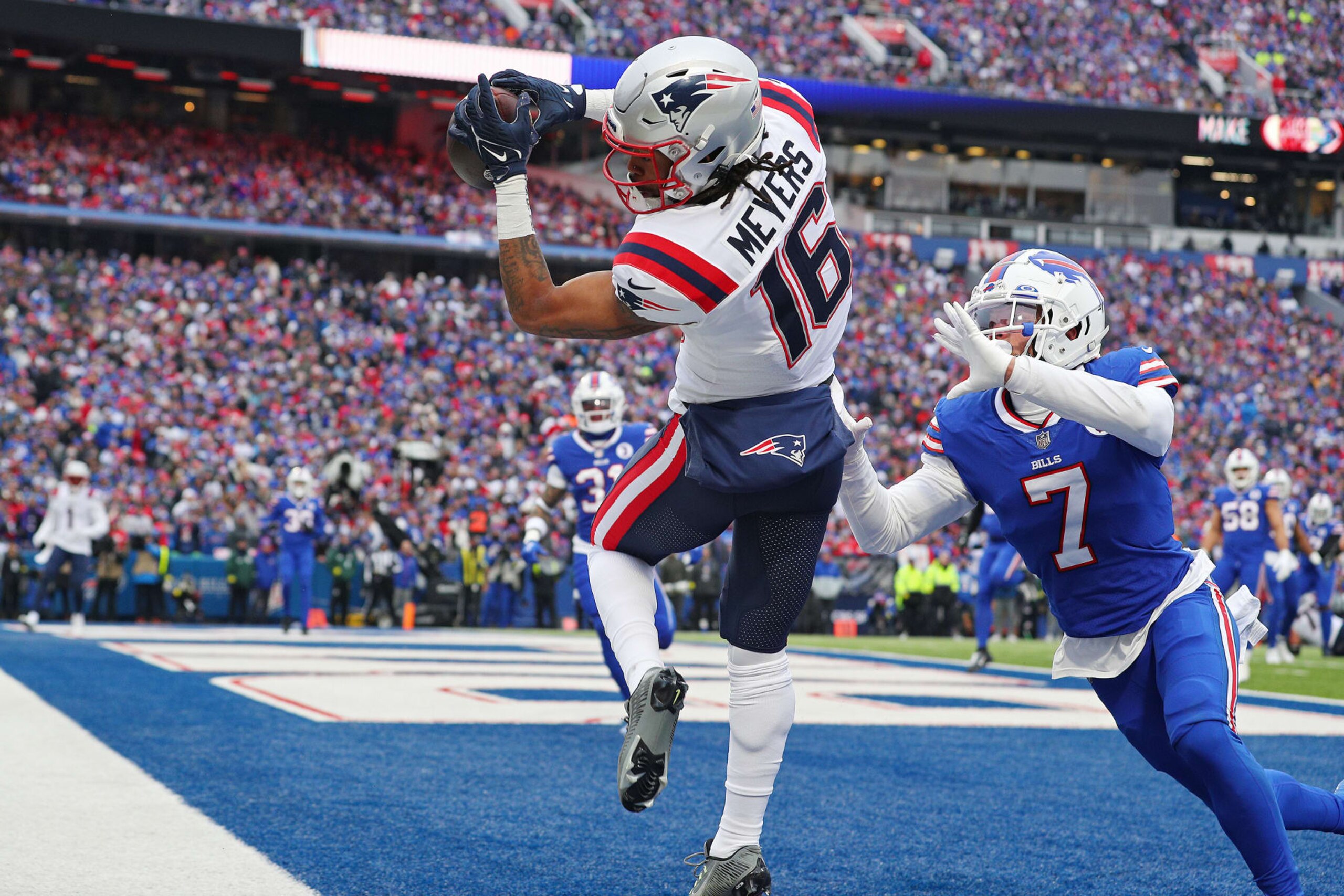 ORCHARD PARK, NEW YORK - JANUARY 08: Jakobi Meyers #16 of the New England Patriots catches a touchdown over Taron Johnson #7 of the Buffalo Bills during the first quarter at Highmark Stadium on January 08, 2023 in Orchard Park, New York. (Photo by Bryan M. Bennett/Getty Images) ORCHARD PARK, NEW YORK - JANUARY 08: Jakobi Meyers #16 of the New England Patriots catches a touchdown over Taron Johnson #7 of the Buffalo Bills during the first quarter at Highmark Stadium on January 08, 2023 in Orchard Park, New York. (Photo by Bryan M. Bennett/Getty Images)