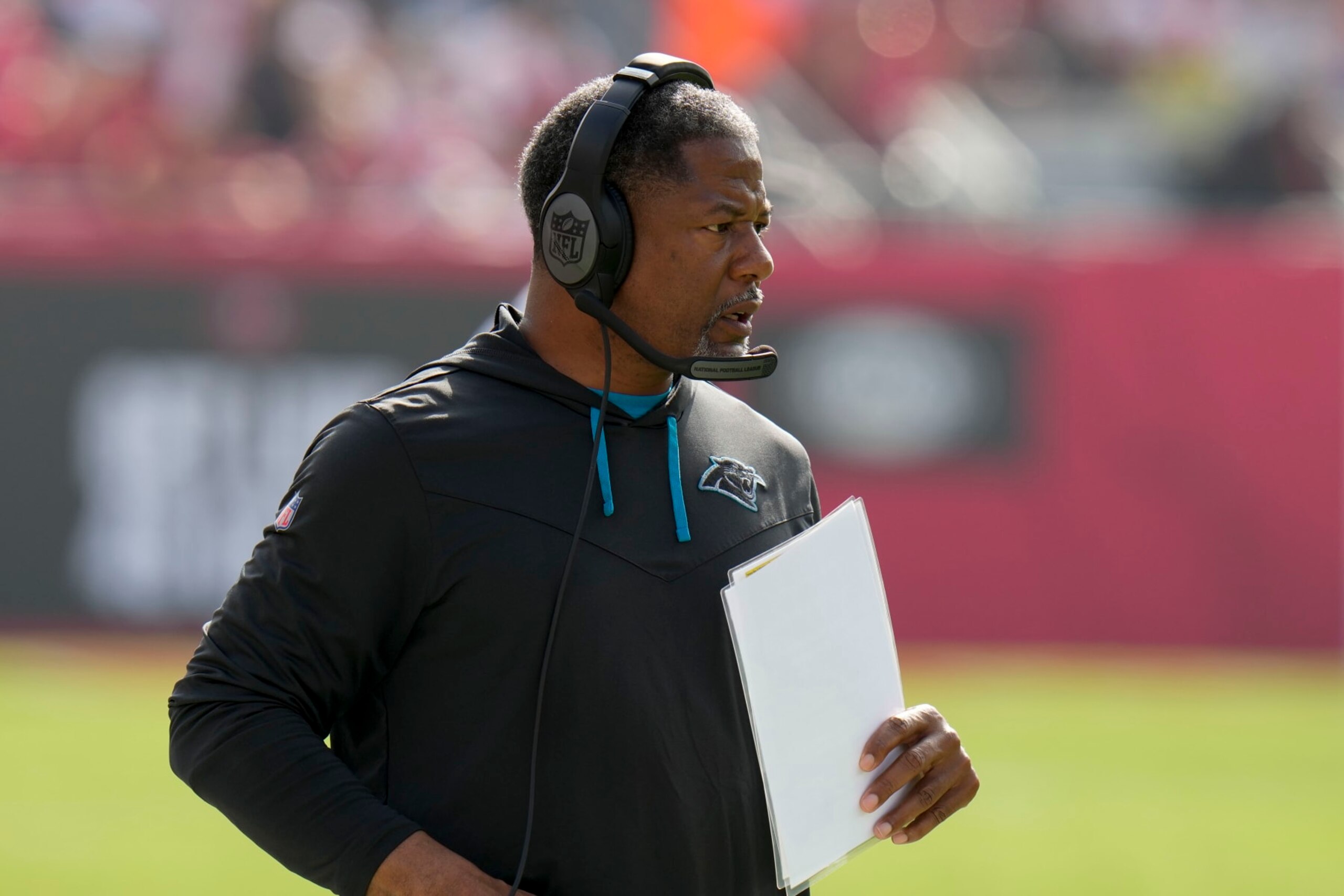 Carolina Panthers head coach Steve Wilks watches during the first half of an NFL football game between the Carolina Panthers and the Tampa Bay Buccaneers on Sunday, Jan. 1, 2023, in Tampa, Fla. (AP Photo/Chris O'Meara)