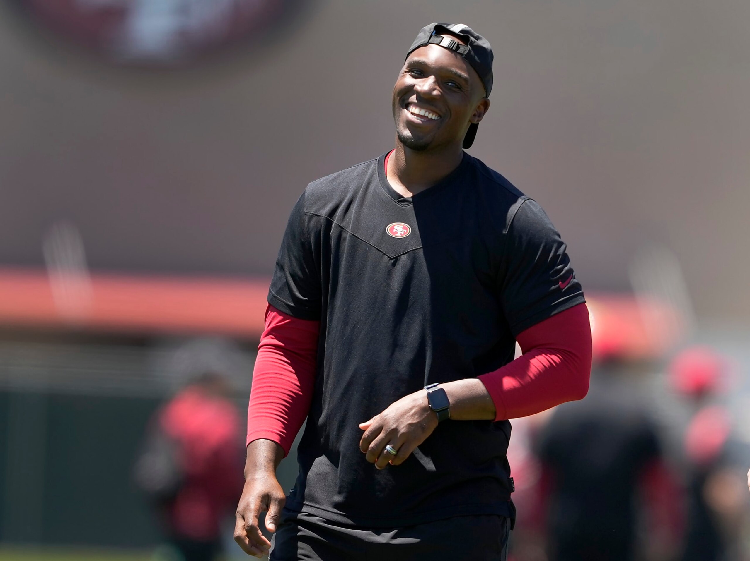 San Francisco 49ers defensive coordinator DeMeco Ryans, smiles as he watches players take part in drills at the NFL football team's practice facility in Santa Clara, Calif., Wednesday, June 1, 2022. (AP Photo/Tony Avelar)