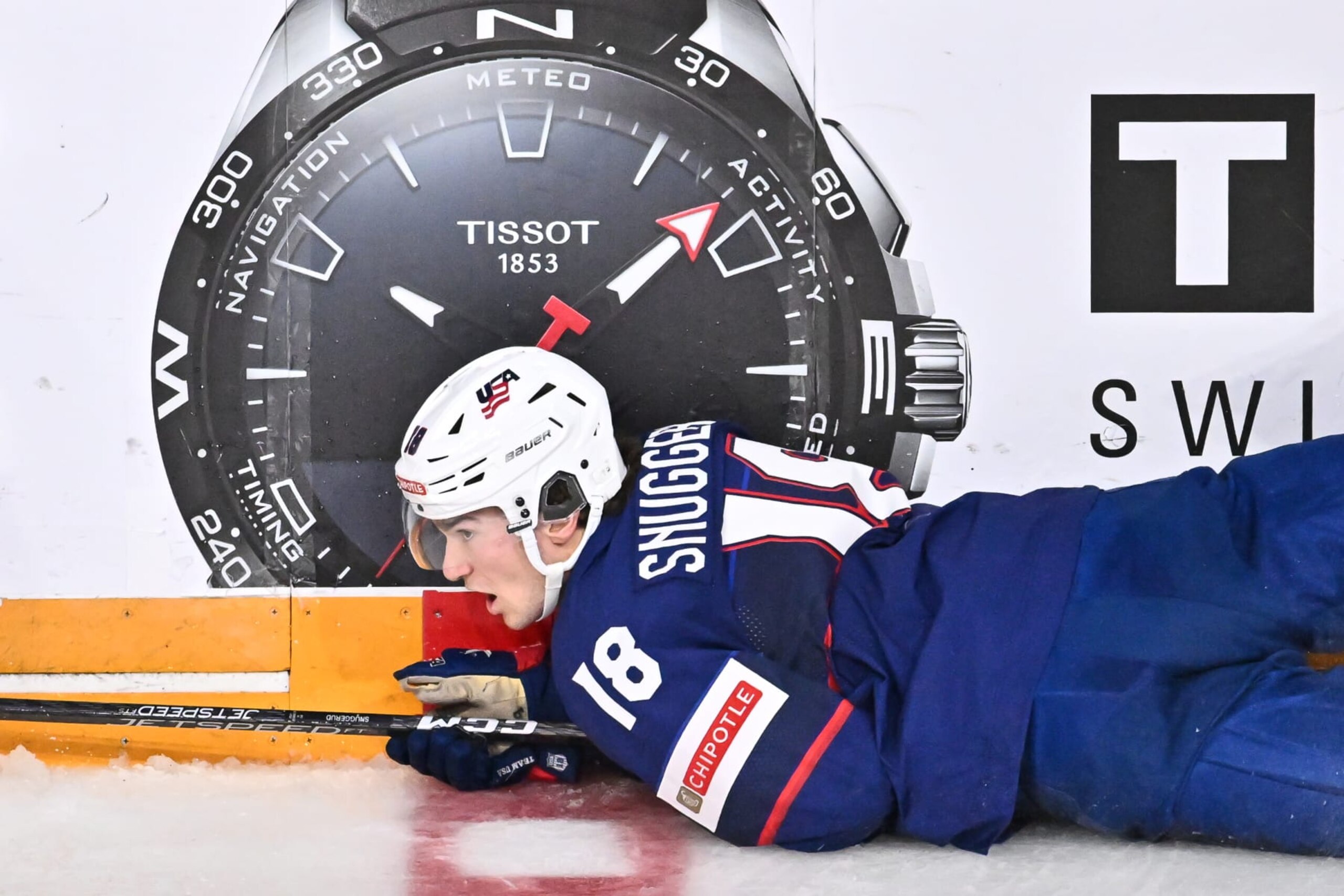 HALIFAX, CANADA - JANUARY 04:  Jimmy Snuggerud #18 of Team United States falls to the ice during the third period against Team Canada in the semifinal round of the 2023 IIHF World Junior Championship at Scotiabank Centre on January 4, 2023 in Halifax, Nova Scotia, Canada.  Team Canada defeated Team United States 6-2.  (Photo by Minas Panagiotakis/Getty Images)