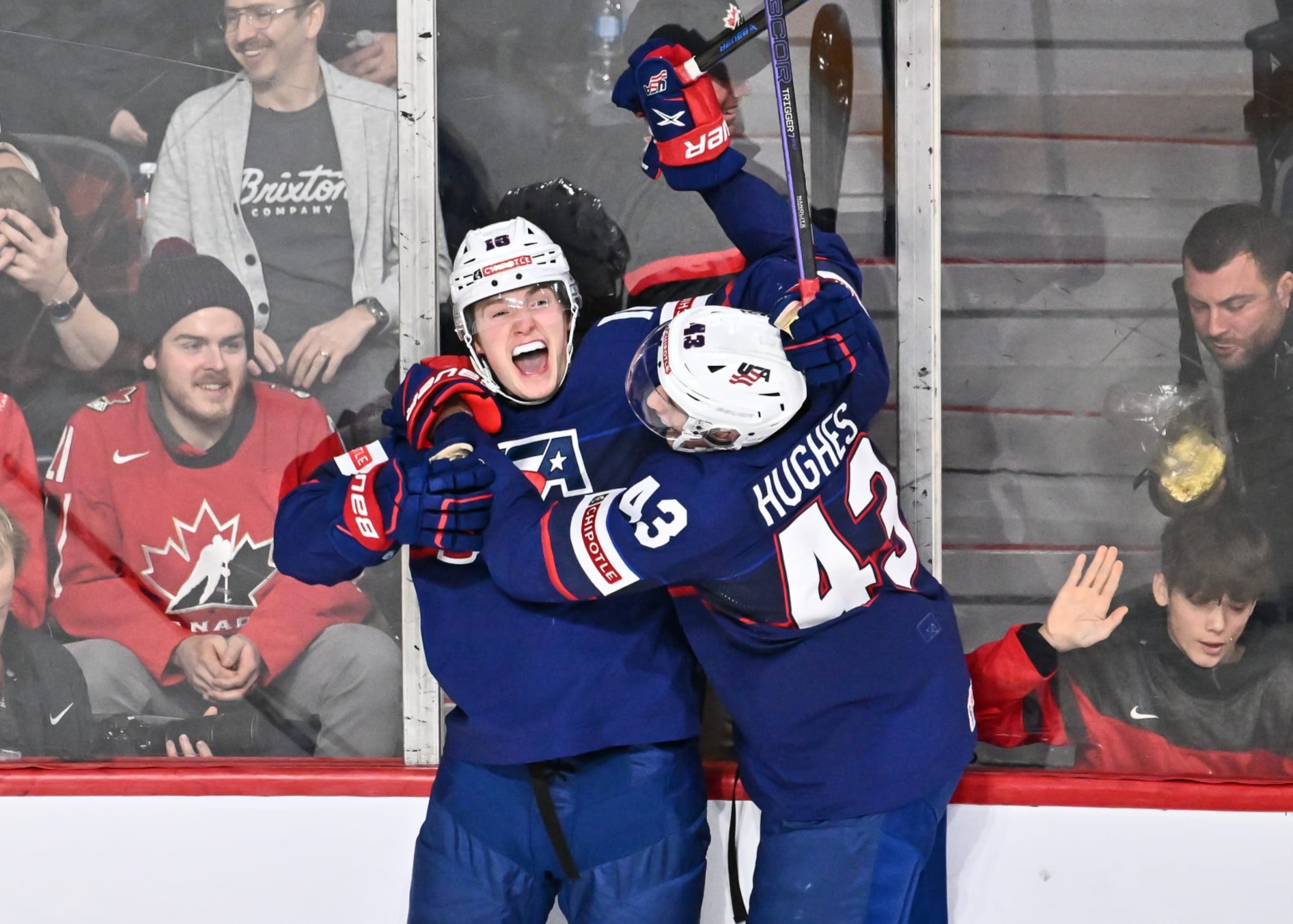 HALIFAX, CANADA - JANUARY 05:  Chaz Lucius #16 of Team United States celebrates his game-winning goal with teammate Luke Hughes #43 during overtime in the bronze medal round of the 2023 IIHF World Junior Championship at Scotiabank Centre on January 5, 2023 in Halifax, Nova Scotia, Canada.  (Photo by Minas Panagiotakis/Getty Images)