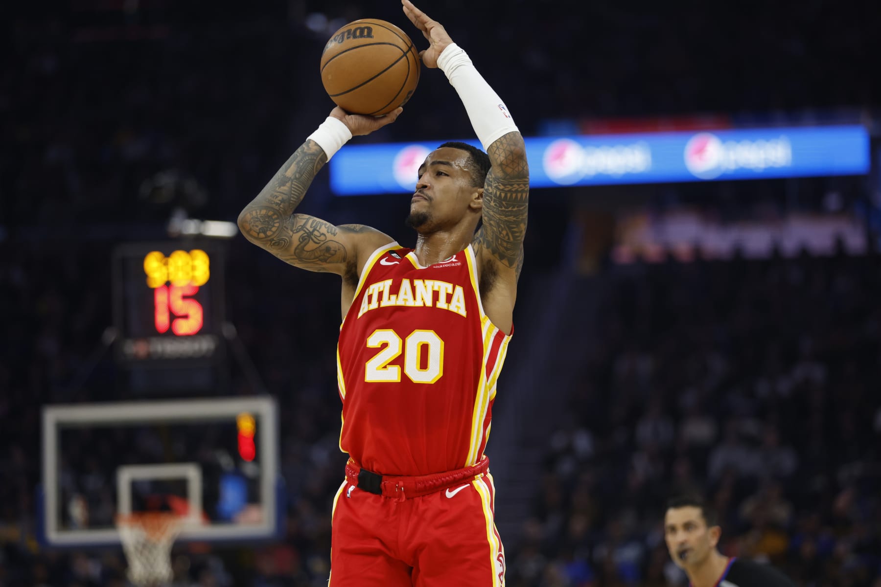 Atlanta Hawks forward John Collins (20) drives shoots against the Golden State Warriors during the first half of an NBA basketball game in San Francisco, Monday, Jan. 2, 2023. (AP Photo/Jed Jacobsohn)