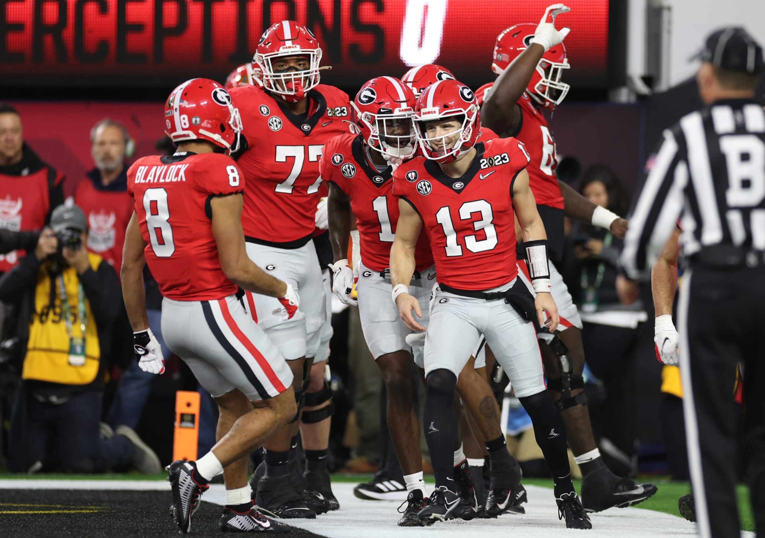 INGLEWOOD, CALIFORNIA - JANUARY 09: Stetson Bennett #13 of the Georgia Bulldogs reacts with teammates after running for a touchdown in the second quarter against the TCU Horned Frogs in the College Football Playoff National Championship game at SoFi Stadium on January 09, 2023 in Inglewood, California. (Photo by Ezra Shaw/Getty Images)