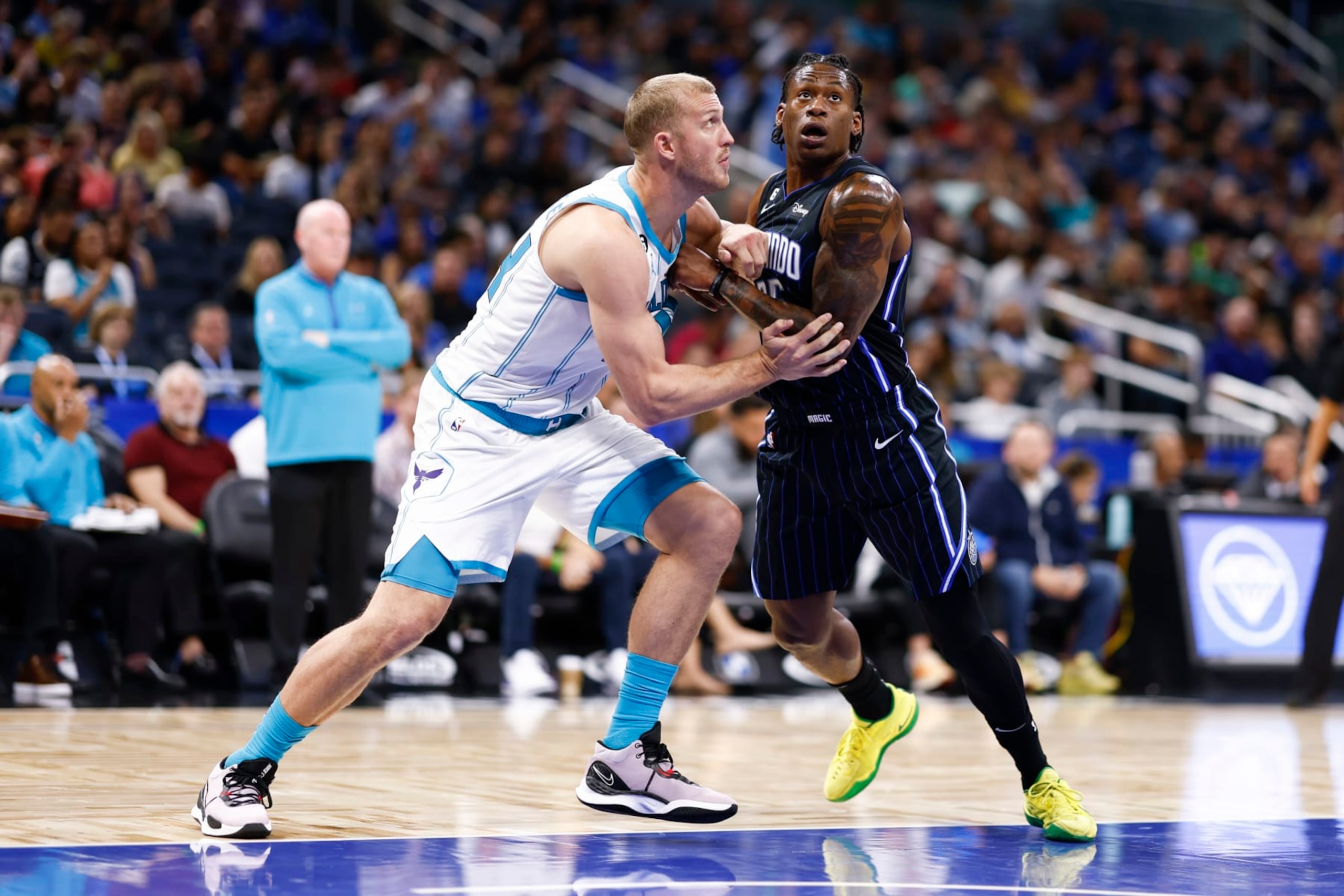 ORLANDO, FLORIDA - OCTOBER 28: Mason Plumlee #24 of the Charlotte Hornets and Admiral Schofield #25 of the Orlando Magic fight for position during the second quarter at Amway Center on October 28, 2022 in Orlando, Florida.  NOTE TO USER: User expressly acknowledges and agrees that, by downloading and or using this photograph, User is consenting to the terms and conditions of the Getty Images License Agreement. (Photo by Douglas P. DeFelice/Getty Images)