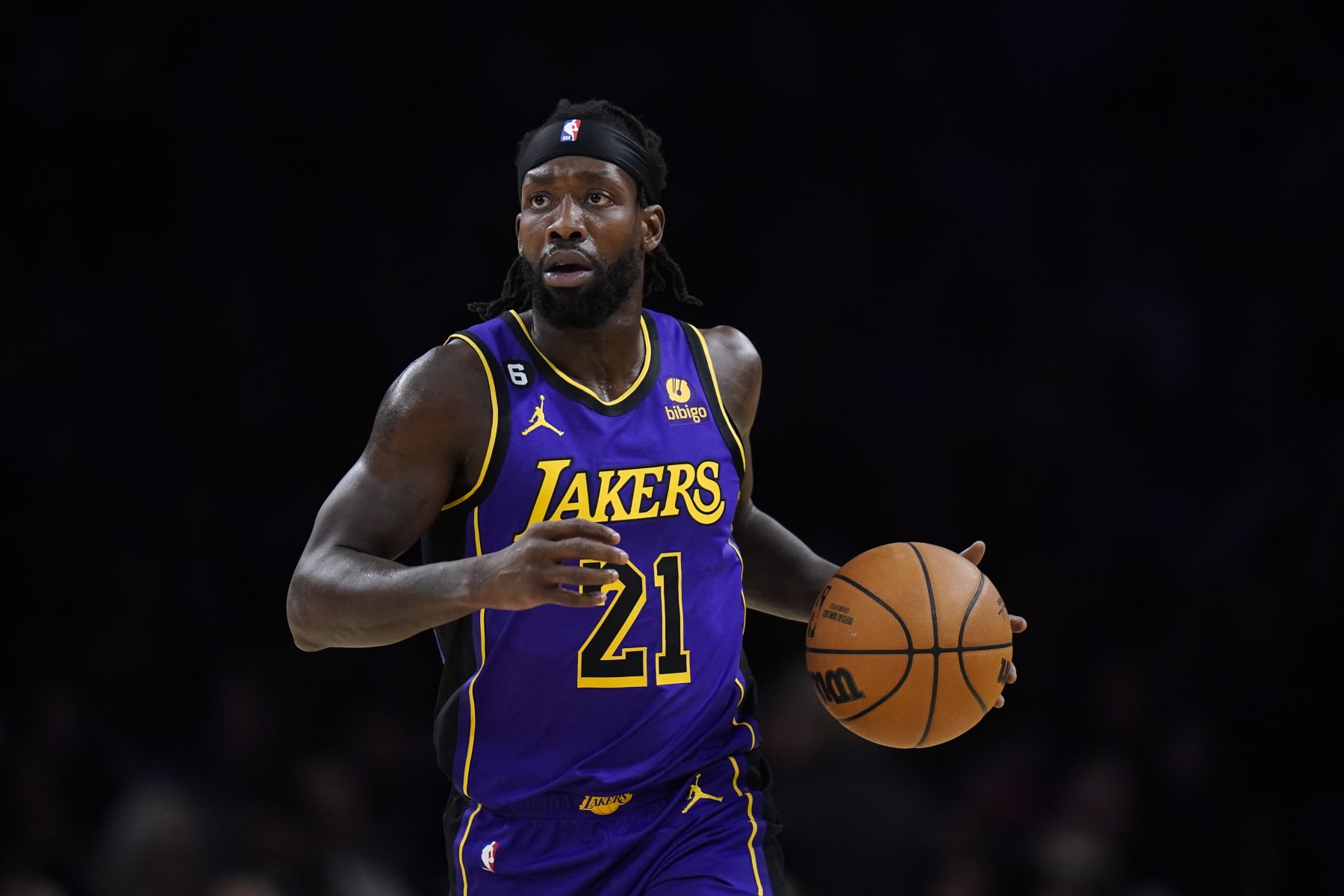 Los Angeles Lakers' Patrick Beverley (21) dribbles during the first half of an NBA basketball game against the Atlanta Hawks Sunday, Jan. 8, 2023, in Los Angeles. (AP Photo/Jae C. Hong)