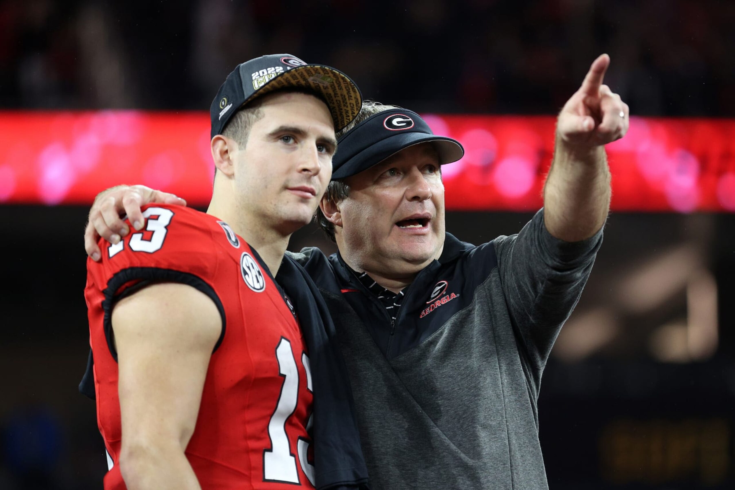 INGLEWOOD, CALIFORNIA - JANUARY 09: Head coach Kirby Smart of the Georgia Bulldogs celebrates with Stetson Bennett #13 after defeating the TCU Horned Frogs in the College Football Playoff National Championship game at SoFi Stadium on January 09, 2023 in Inglewood, California. Georgia defeated TCU 65-7.  (Photo by Ezra Shaw/Getty Images)