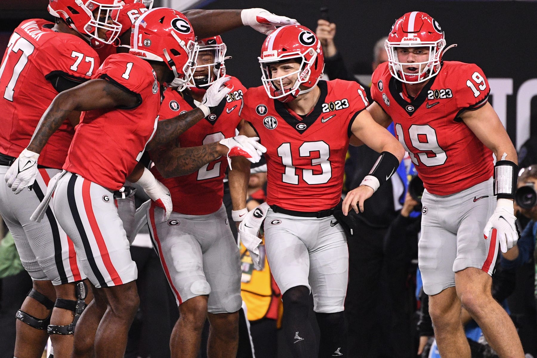 INGLEWOOD, CA - JANUARY 09: Georgia Bulldogs quarterback Stetson Bennett (13) celebrates with his teammates after a touchdown during the Georgia Bulldogs game versus the TCU Horned Frogs in the College Football Playoff National Championship game on January 9, 2023, at SoFi Stadium in Inglewood, CA. (Photo by Brian Rothmuller/Icon Sportswire via Getty Images)