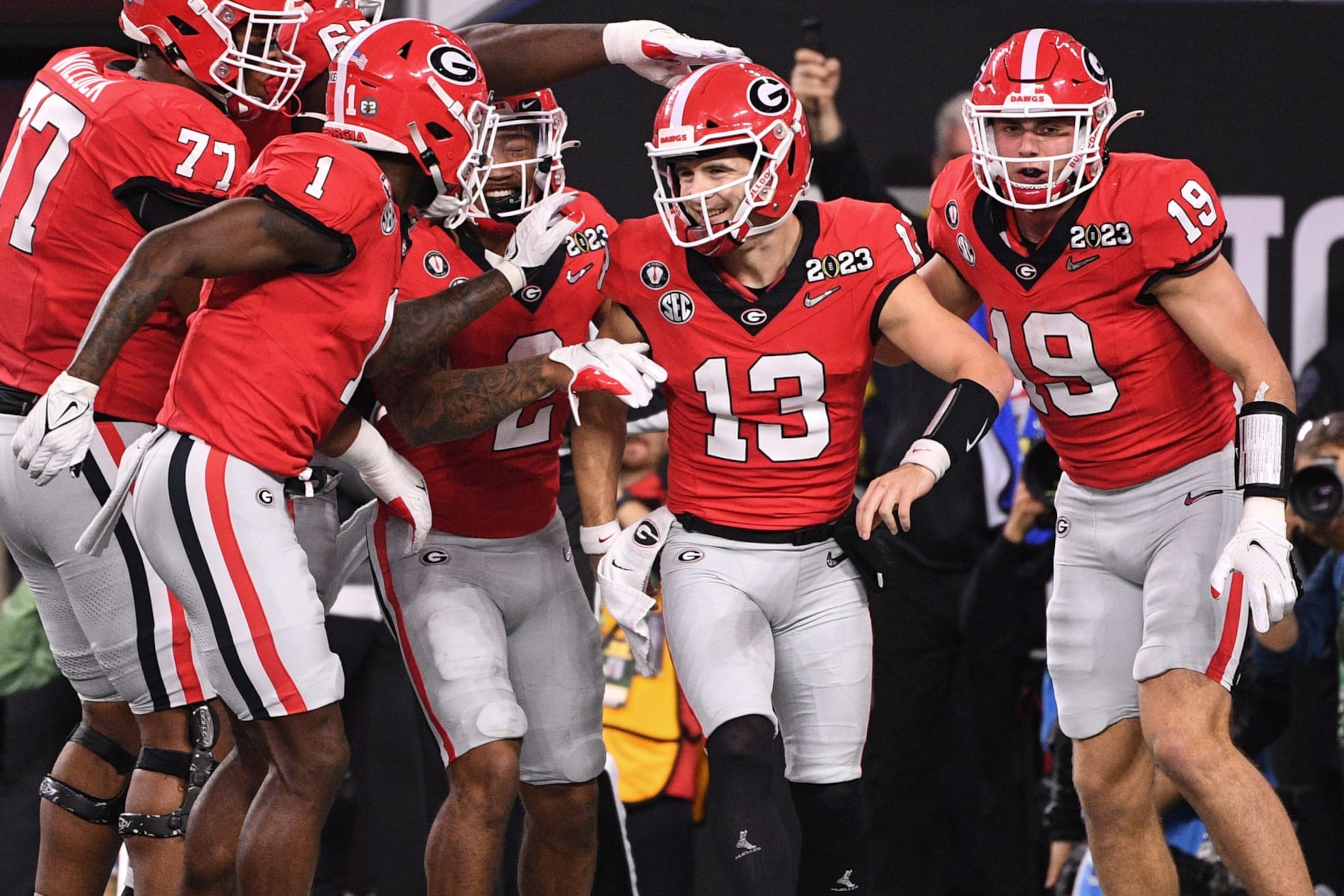 INGLEWOOD, CA - JANUARY 09: Georgia Bulldogs quarterback Stetson Bennett (13) celebrates with his teammates after a touchdown during the Georgia Bulldogs game versus the TCU Horned Frogs in the College Football Playoff National Championship game on January 9, 2023, at SoFi Stadium in Inglewood, CA. (Photo by Brian Rothmuller/Icon Sportswire via Getty Images)