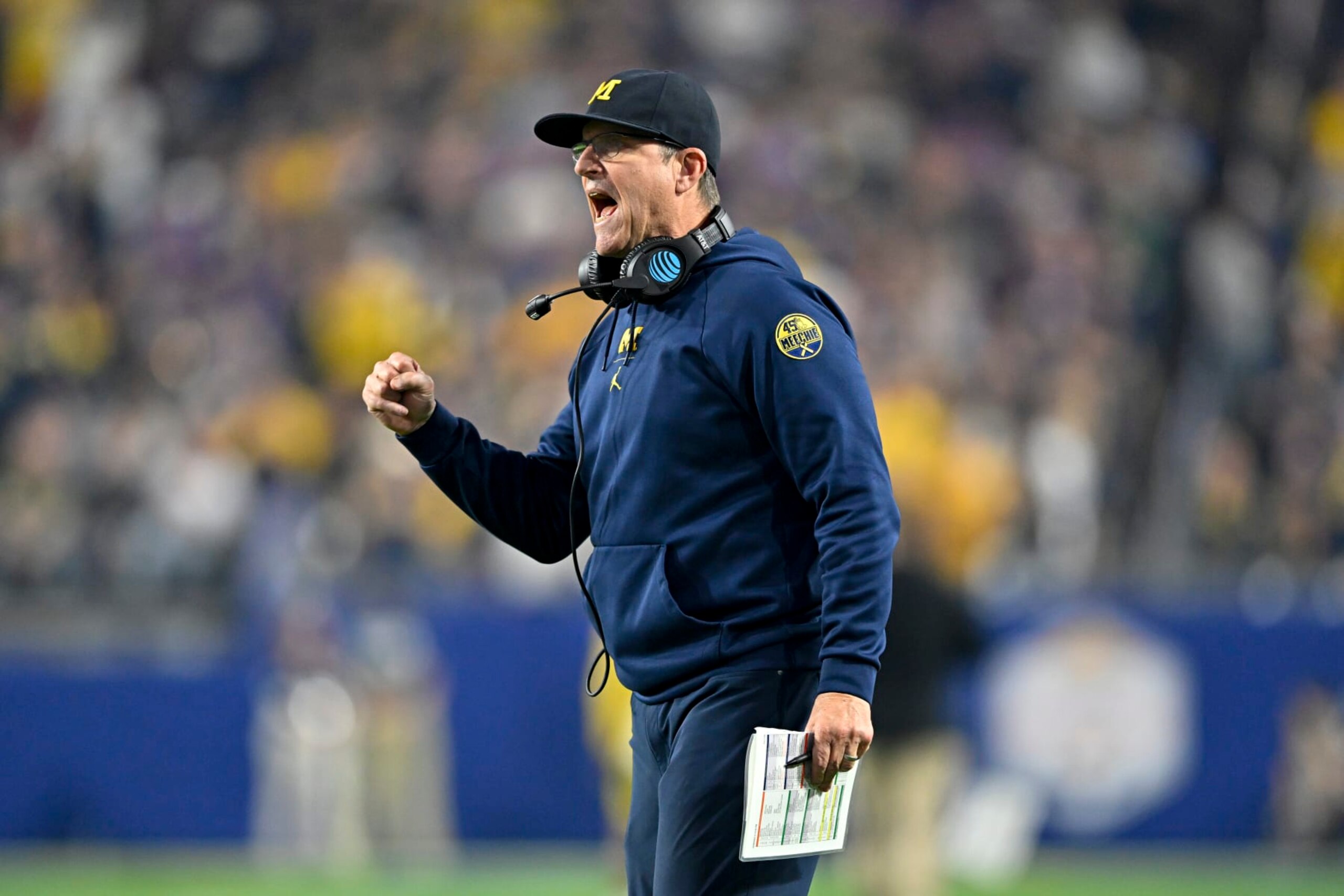 GLENDALE, ARIZONA - DECEMBER 31: Head coach Jim Harbaugh of the Michigan Wolverines gestures during the third quarter of the College Football Playoff Semifinal Fiesta Bowl football game against the TCU Horned Frogs at State Farm Stadium on December 31, 2022 in Glendale, Arizona. The TCU Horned Frogs won 51-45. (Photo by Alika Jenner/Getty Images)
