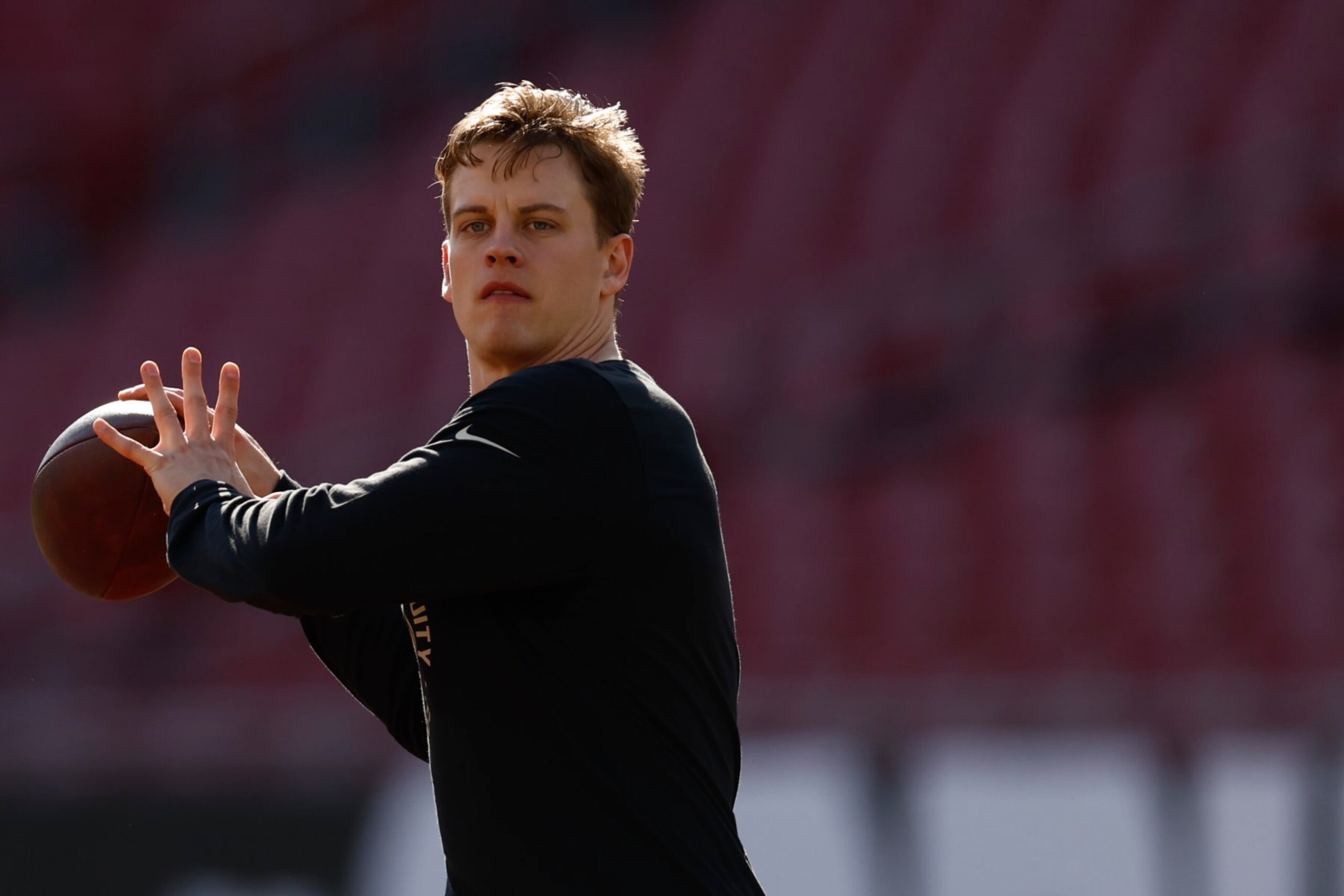 TAMPA, FLORIDA - DECEMBER 18: Joe Burrow #9 of the Cincinnati Bengals warms up prior to the game against the Tampa Bay Buccaneers at Raymond James Stadium on December 18, 2022 in Tampa, Florida. (Photo by Douglas P. DeFelice/Getty Images) TAMPA, FLORIDA - DECEMBER 18: Joe Burrow #9 of the Cincinnati Bengals warms up prior to the game against the Tampa Bay Buccaneers at Raymond James Stadium on December 18, 2022 in Tampa, Florida. (Photo by Douglas P. DeFelice/Getty Images)