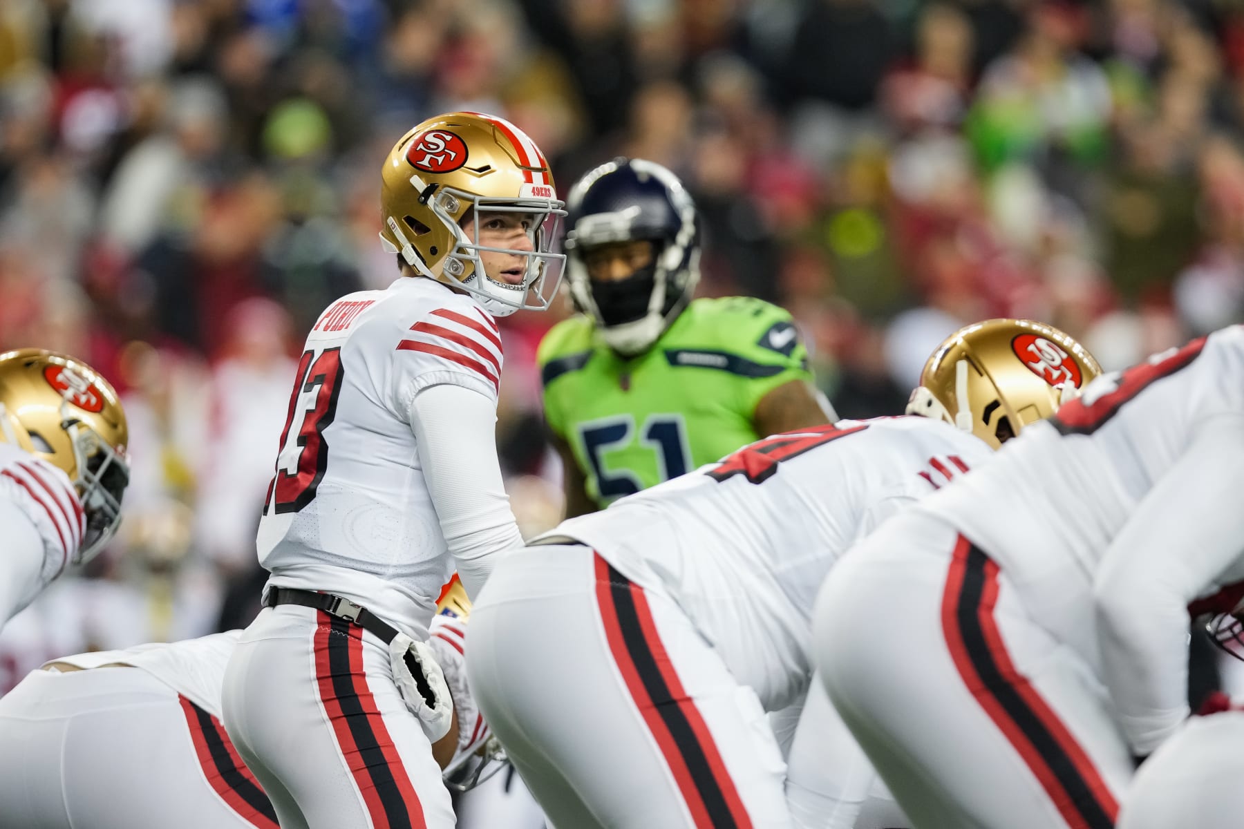 SEATTLE, WASHINGTON - DECEMBER 15: Brock Purdy #13 of the San Francisco 49ers calls a play at the line of scrimmage during the first quarter of a game against the Seattle Seahawks at Lumen Field on December 15, 2022 in Seattle, Washington. (Photo by Christopher Mast/Getty Images)