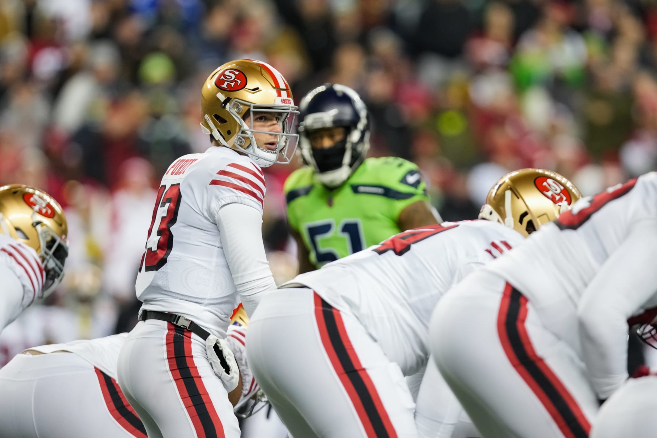 SEATTLE, WASHINGTON - DECEMBER 15: Brock Purdy #13 of the San Francisco 49ers calls a play at the line of scrimmage during the first quarter of a game against the Seattle Seahawks at Lumen Field on December 15, 2022 in Seattle, Washington. (Photo by Christopher Mast/Getty Images)