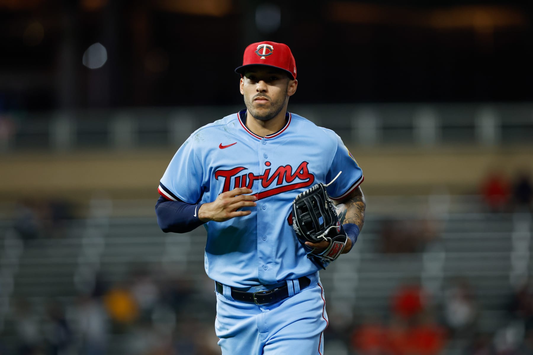 MINNEAPOLIS, MN - SEPTEMBER 14:   Carlos Correa #4 of the Minnesota Twins returns to the dugout in the eighth inning during the game between the Kansas City Royals and the Minnesota Twins at Target Field on Wednesday, September 14, 2022 in Minneapolis, Minnesota. (Photo by David Berding/MLB Photos via Getty Images)