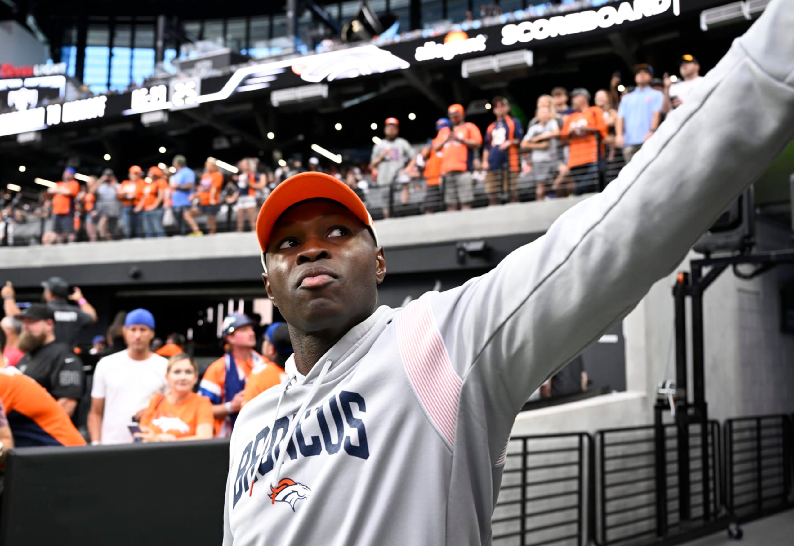 LAS VEGAS, NEVADA - OCTOBER 2: Denver Broncos Defensive Coordinator Ejiro Evero gives a fan a high-five at Allegiant Stadium on October 2, 2022 in Las Vegas, Nevada. The Denver Broncos will take on the home team Las Vegas Raiders during week four of the NFL season. (Photo by  RJ Sangosti/MediaNews Group/The Denver Post via Getty Images)