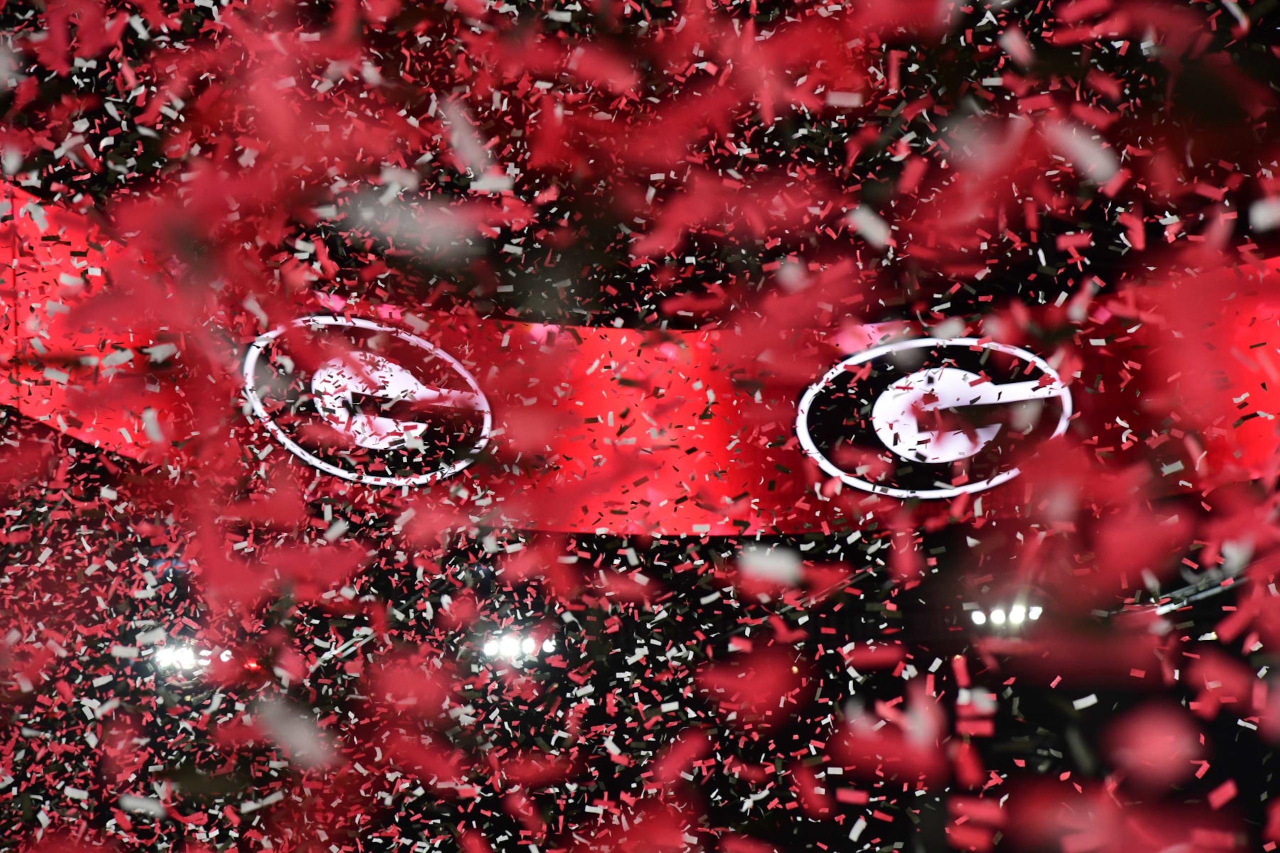 INGLEWOOD, CA - JANUARY 09: Red and black confetti fills the air the the Georgia Bulldogs logo is displayed on the scoreboard after the Georgia Bulldogs 65-7 victory over the TCU Horned Frogs in the College Football Playoff National Championship game on January 9, 2023, at SoFi Stadium in Inglewood, CA. (Photo by John Cordes/Icon Sportswire via Getty Images) INGLEWOOD, CA - JANUARY 09: Red and black confetti fills the air the the Georgia Bulldogs logo is displayed on the scoreboard after the Georgia Bulldogs 65-7 victory over the TCU Horned Frogs in the College Football Playoff National Championship game on January 9, 2023, at SoFi Stadium in Inglewood, CA. (Photo by John Cordes/Icon Sportswire via Getty Images)