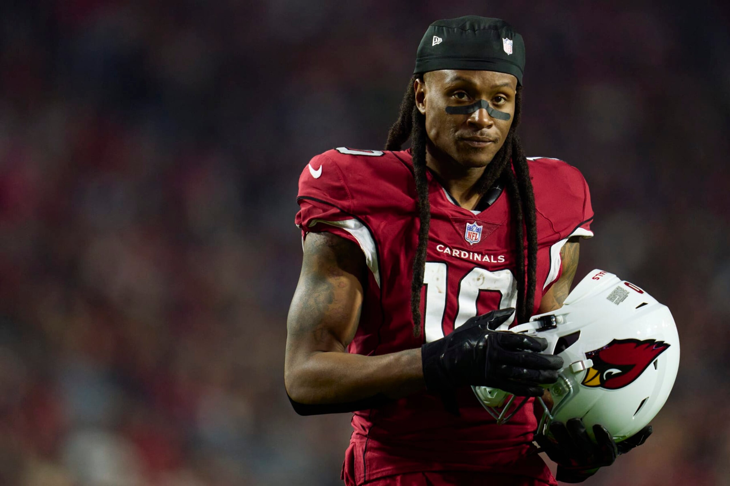 GLENDALE, AZ - DECEMBER 12: DeAndre Hopkins #10 of the Arizona Cardinals looks towards the sideline against the New England Patriots during the second half at State Farm Stadium on December 12, 2022 in Glendale, Arizona. (Photo by Cooper Neill/Getty Images) GLENDALE, AZ - DECEMBER 12: DeAndre Hopkins #10 of the Arizona Cardinals looks towards the sideline against the New England Patriots during the second half at State Farm Stadium on December 12, 2022 in Glendale, Arizona. (Photo by Cooper Neill/Getty Images)