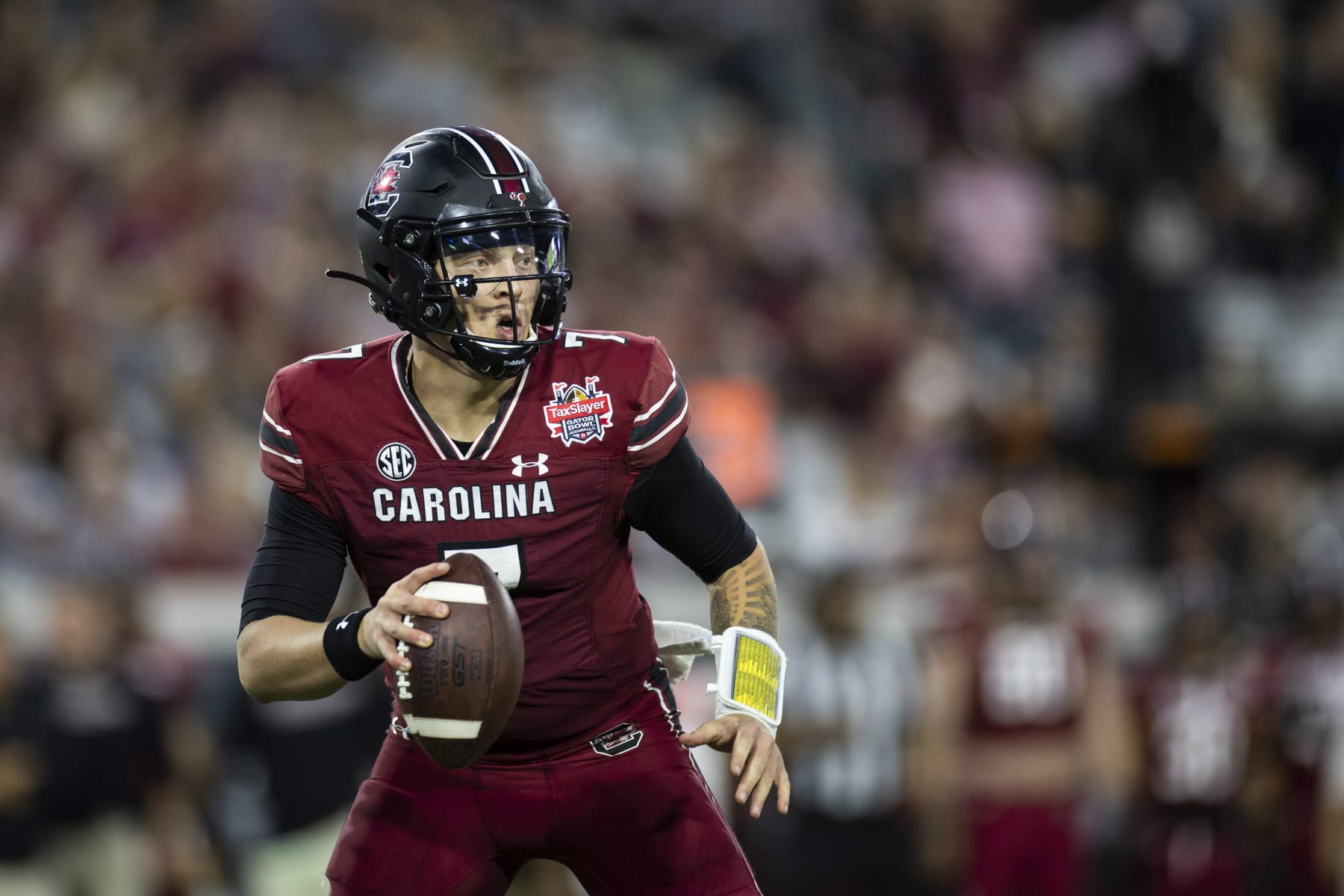 JACKSONVILLE, FLORIDA - DECEMBER 30: Spencer Rattler #7 of the South Carolina Gamecocks looks to pass against the Notre Dame Fighting Irish during the second half of the TaxSlayer Gator Bowl at TIAA Bank Field on December 30, 2022 in Jacksonville, Florida. (Photo by James Gilbert/Getty Images)