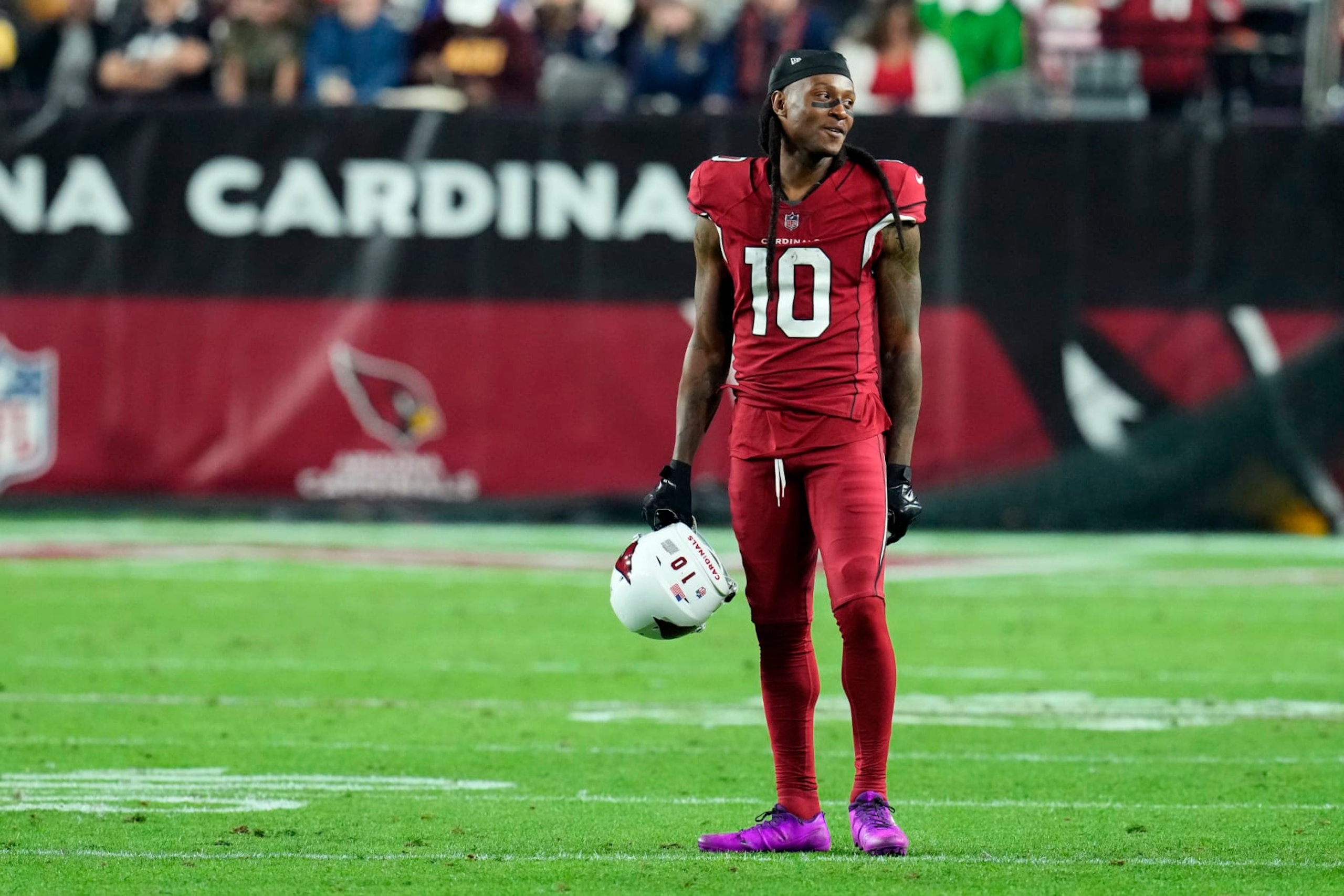 Arizona Cardinals wide receiver DeAndre Hopkins (10) stands on the field during the first half of an NFL football game against the New England Patriots, Monday, Dec. 12, 2022, in Glendale, Ariz. (AP Photo/Ross D. Franklin) Arizona Cardinals wide receiver DeAndre Hopkins (10) stands on the field during the first half of an NFL football game against the New England Patriots, Monday, Dec. 12, 2022, in Glendale, Ariz. (AP Photo/Ross D. Franklin)