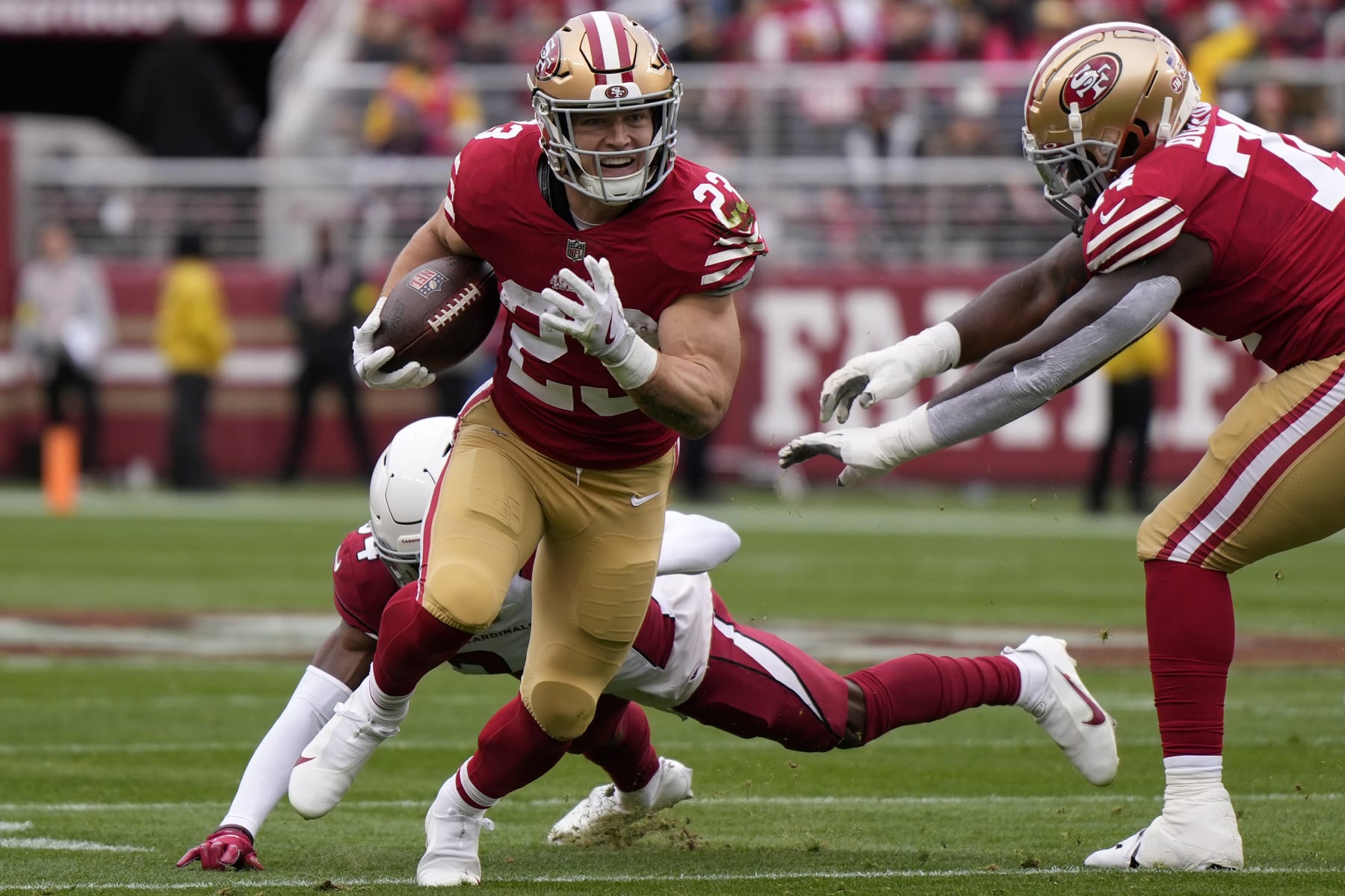 SANTA CLARA, CALIFORNIA - JANUARY 08: Christian McCaffrey #23 of the San Francisco 49ers runs the ball for a touchdown during the first quarter against the Arizona Cardinals at Levi's Stadium on January 08, 2023 in Santa Clara, California. (Photo by Thearon W. Henderson/Getty Images)