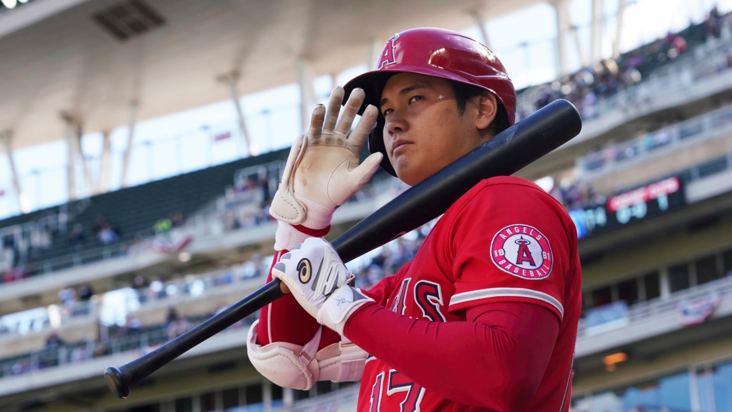 Los Angeles Angels' pitcher Shohei Ohtani (17) waves to fans as he waits on deck to bat in a baseball game against the Minnesota Twins, Sunday, Sept 25, 2022, in Minneapolis. (AP Photo/Jim Mone)