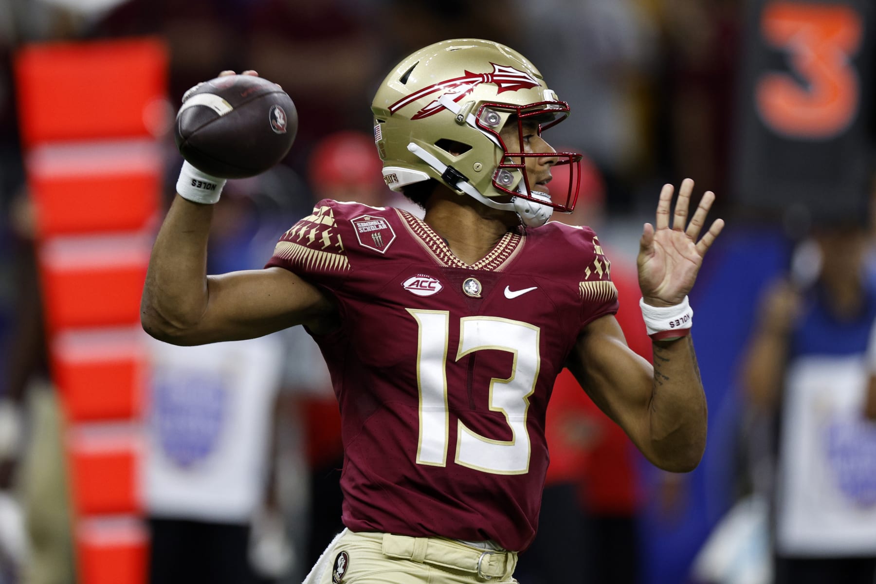 NEW ORLEANS, LOUISIANA - SEPTEMBER 04: Quarterback Jordan Travis #13 of the Florida State Seminoles throws a pass against the LSU Tigers at Caesars Superdome on September 04, 2022 in New Orleans, Louisiana. (Photo by Chris Graythen/Getty Images)