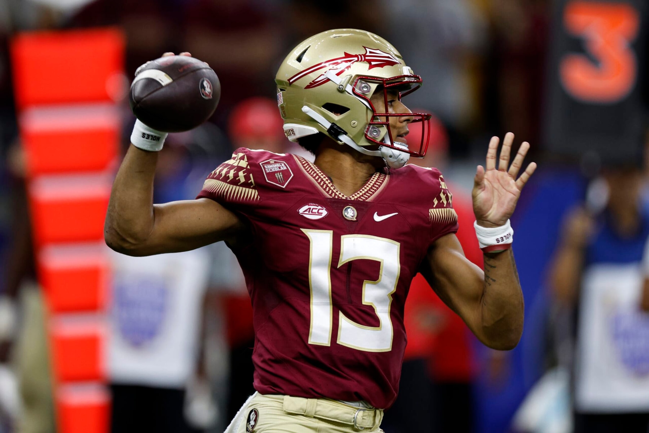 NEW ORLEANS, LOUISIANA - SEPTEMBER 04: Quarterback Jordan Travis #13 of the Florida State Seminoles throws a pass against the LSU Tigers at Caesars Superdome on September 04, 2022 in New Orleans, Louisiana. (Photo by Chris Graythen/Getty Images) NEW ORLEANS, LOUISIANA - SEPTEMBER 04: Quarterback Jordan Travis #13 of the Florida State Seminoles throws a pass against the LSU Tigers at Caesars Superdome on September 04, 2022 in New Orleans, Louisiana. (Photo by Chris Graythen/Getty Images)