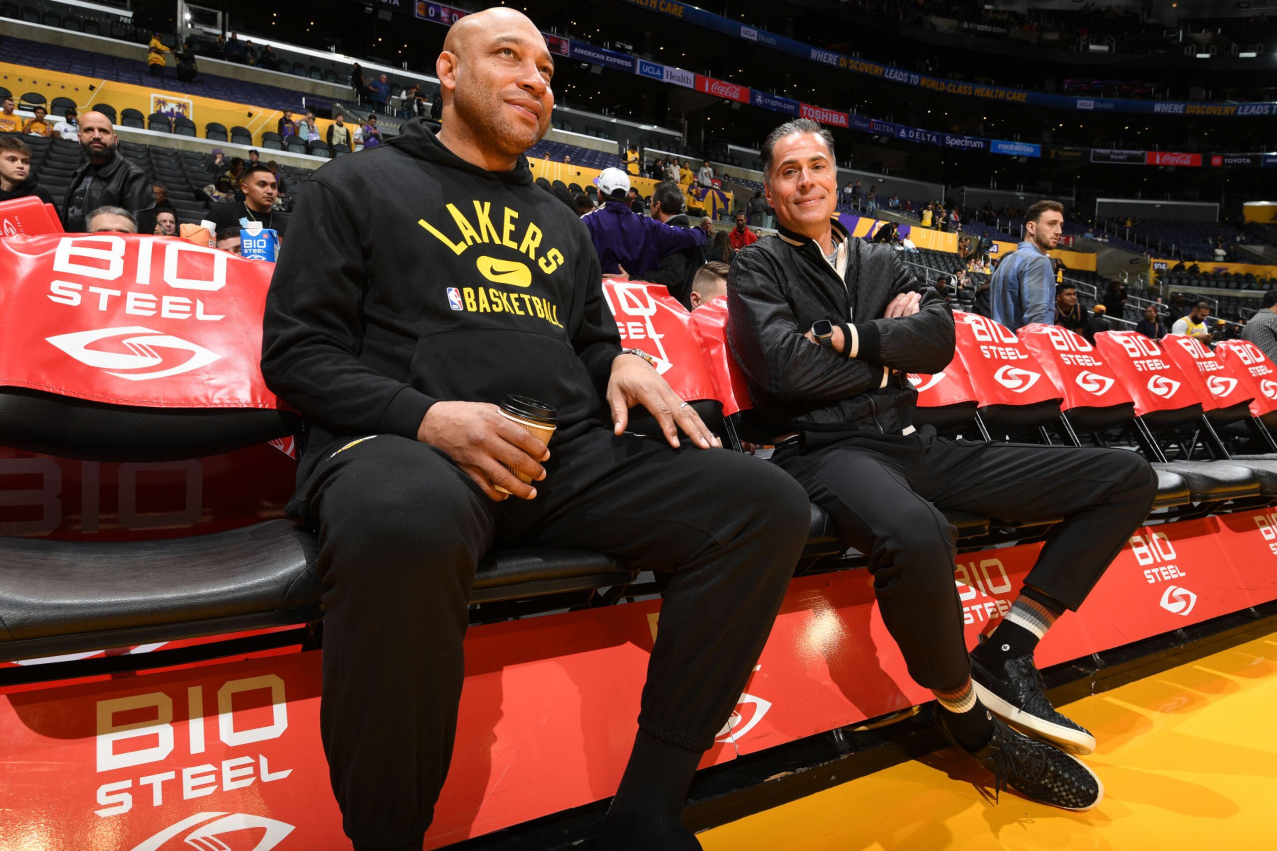 LOS ANGELES, CA - JANUARY 6: Head Coach Darvin Ham of the Los Angeles Lakers and Los Angeles Lakers GM Rob Pelinka look on before the game between the Atlanta Hawks and the Los Angeles Lakers on January 6, 2023 at Crypto.Com Arena in Los Angeles, California. NOTE TO USER: User expressly acknowledges and agrees that, by downloading and/or using this Photograph, user is consenting to the terms and conditions of the Getty Images License Agreement. Mandatory Copyright Notice: Copyright 2023 NBAE (Photo by Andrew D. Bernstein/NBAE via Getty Images)