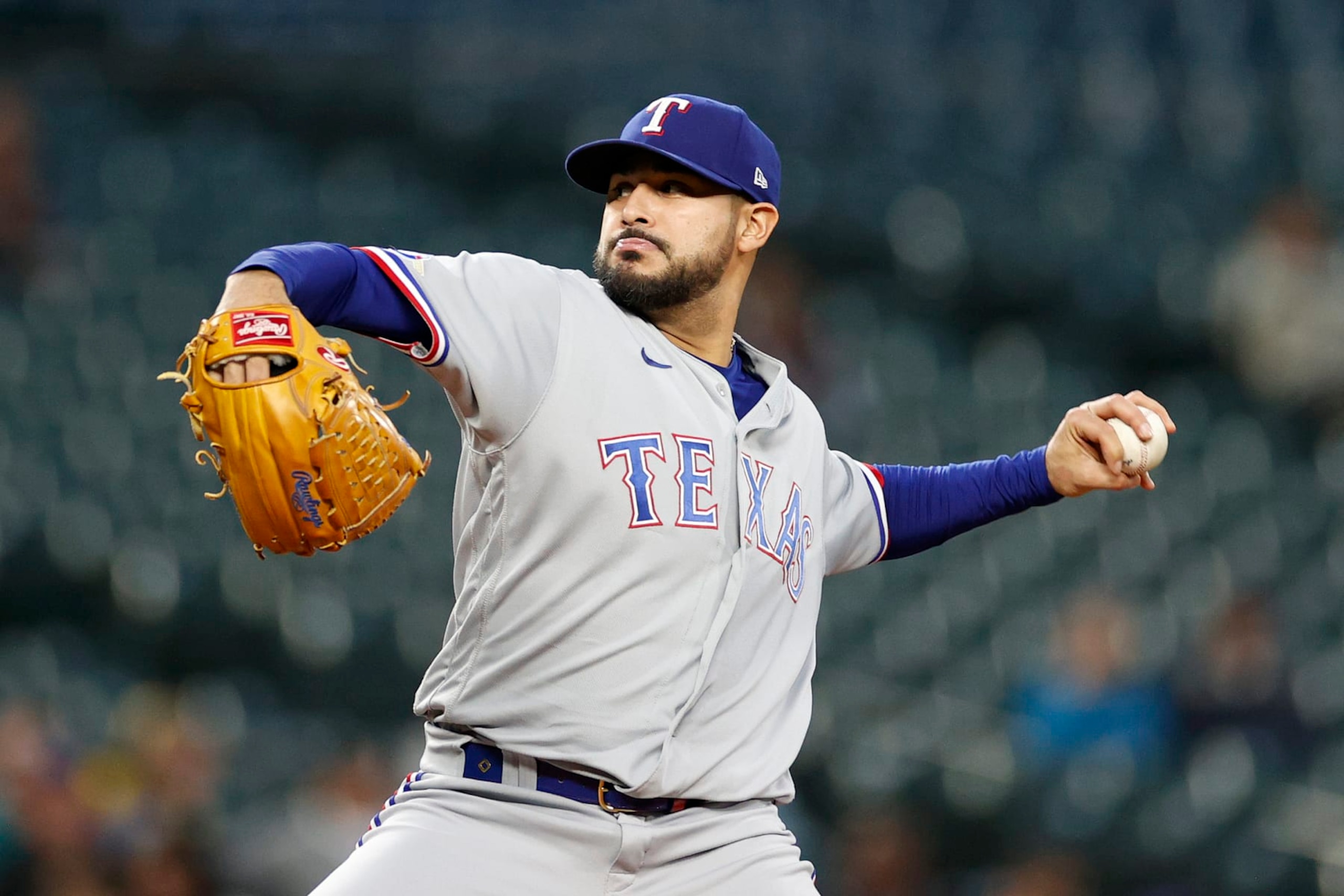 SEATTLE, WASHINGTON - SEPTEMBER 28: Martin Perez #54 of the Texas Rangers pitches during the first inning against the Seattle Mariners at T-Mobile Park on September 28, 2022 in Seattle, Washington. (Photo by Steph Chambers/Getty Images)