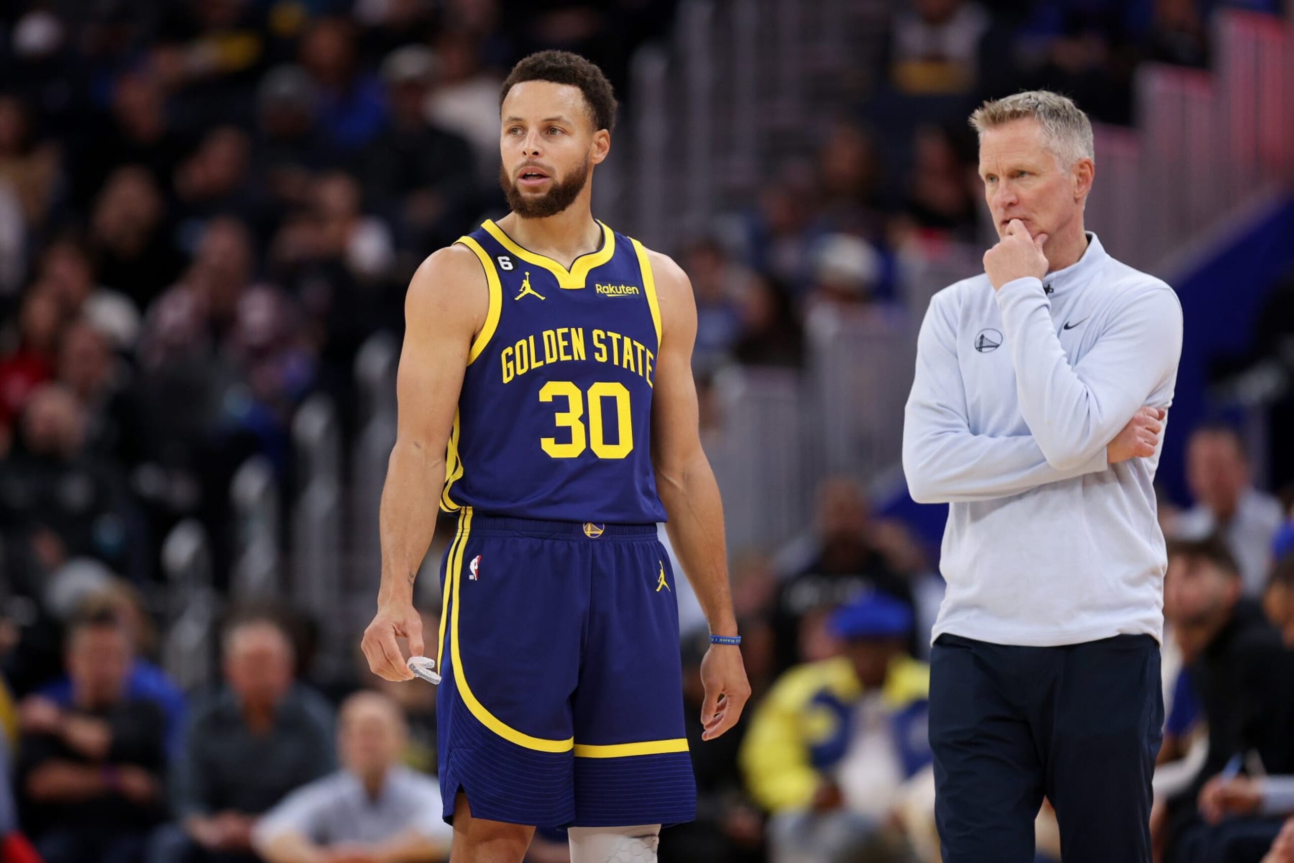 SAN FRANCISCO, CALIFORNIA - DECEMBER 02: Stephen Curry #30 of the Golden State Warriors talks to head coach Steve Kerr during their game against the Chicago Bulls at Chase Center on December 02, 2022 in San Francisco, California. NOTE TO USER: User expressly acknowledges and agrees that, by downloading and or using this photograph, User is consenting to the terms and conditions of the Getty Images License Agreement.  (Photo by Ezra Shaw/Getty Images)