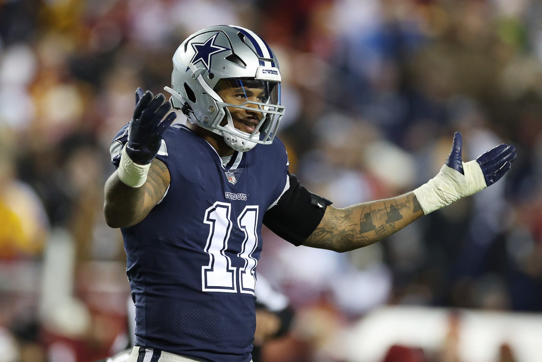 LANDOVER, MARYLAND - JANUARY 08: Micah Parsons #11 of the Dallas Cowboys looks on during the second half of the game against the Washington Commanders at FedExField on January 08, 2023 in Landover, Maryland. (Photo by Rob Carr/Getty Images)