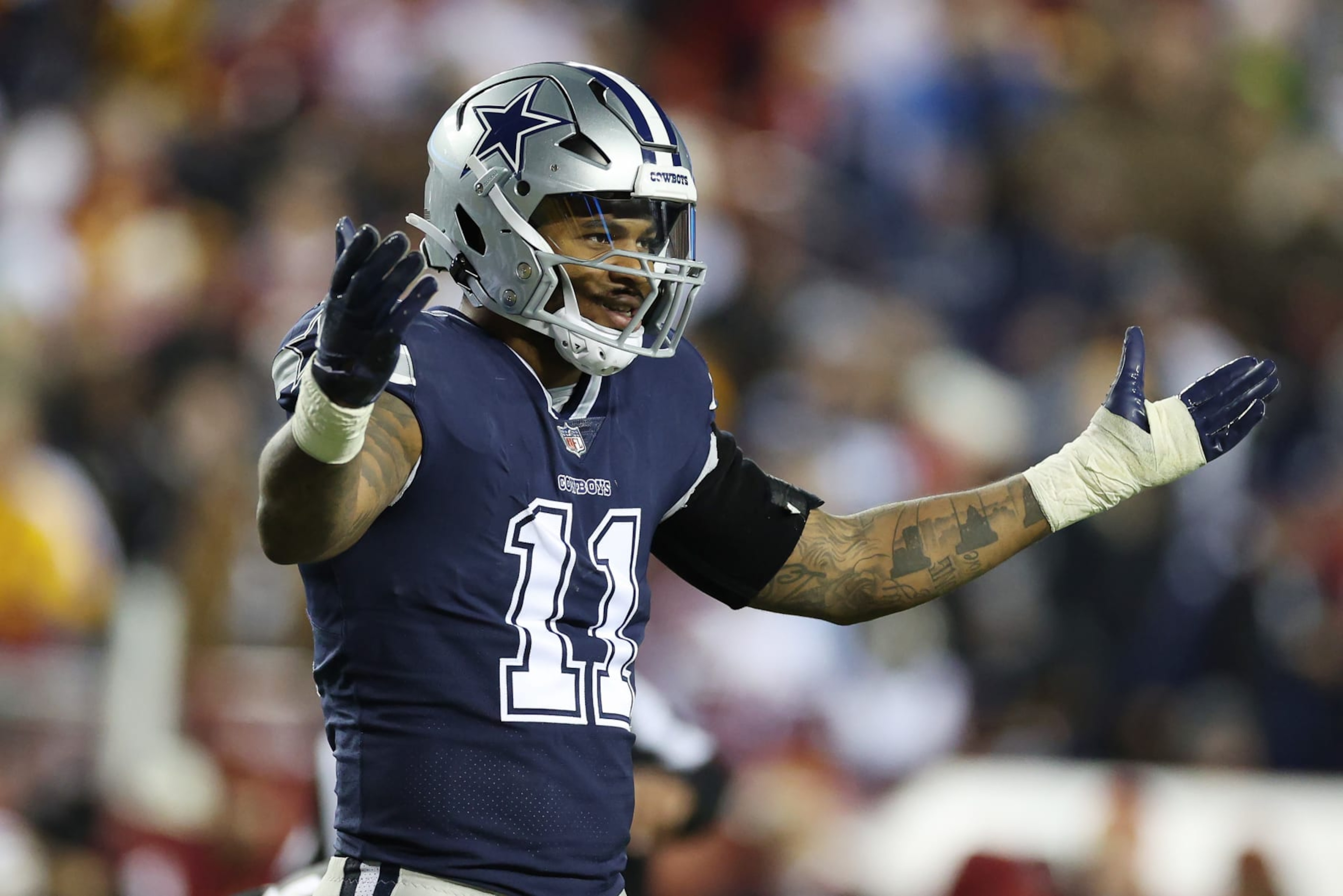 LANDOVER, MARYLAND - JANUARY 08: Micah Parsons #11 of the Dallas Cowboys looks on during the second half of the game against the Washington Commanders at FedExField on January 08, 2023 in Landover, Maryland. (Photo by Rob Carr/Getty Images)