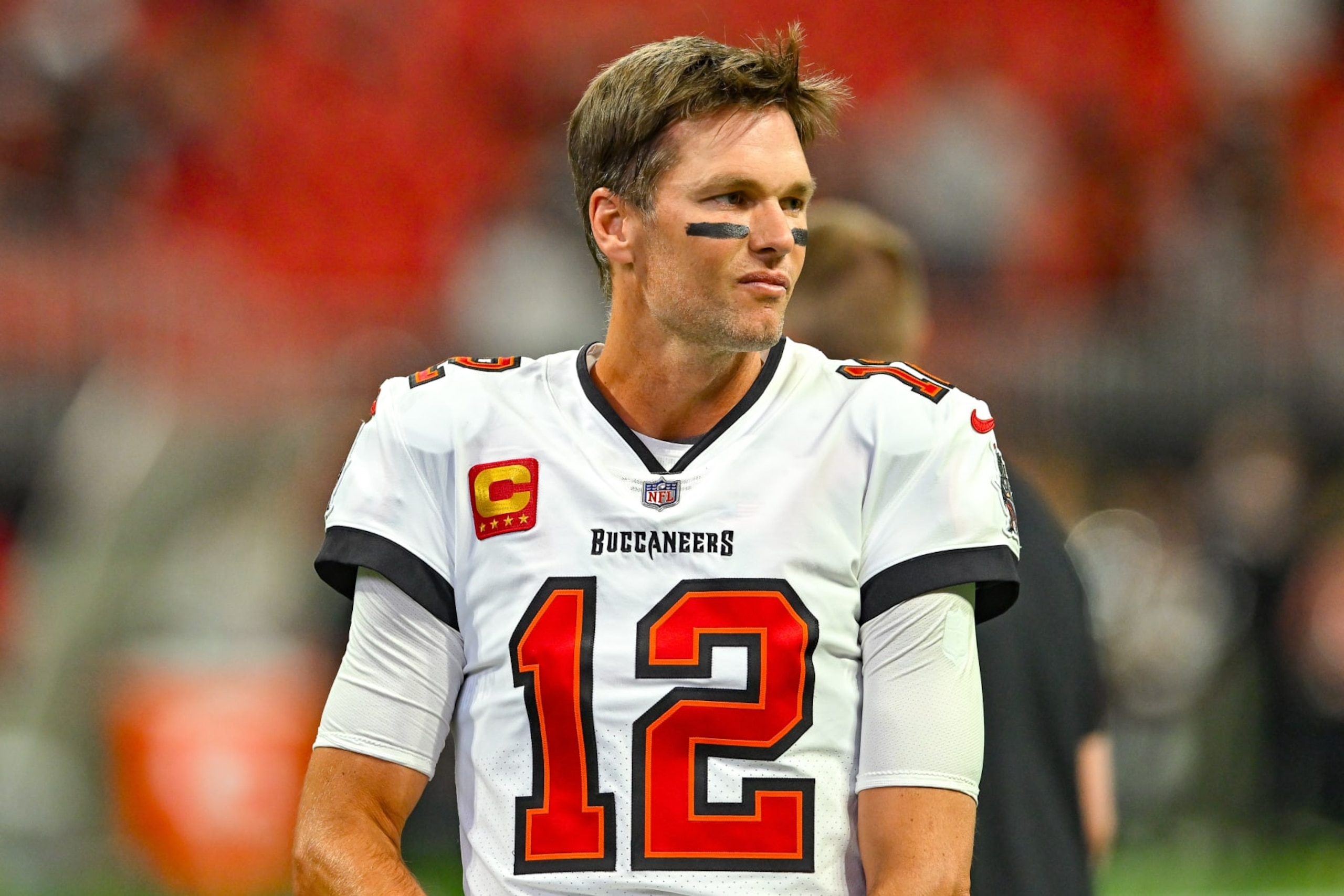 ATLANTA, GA  JANUARY 08:  Tampa Bay quarterback Tom Brady (12) warms up prior to the start of the NFL game between the Tampa Bay Buccaneers and the Atlanta Falcons on January 8th, 2023 at Mercedes-Benz Stadium in Atlanta, GA.  (Photo by Rich von Biberstein/Icon Sportswire via Getty Images)