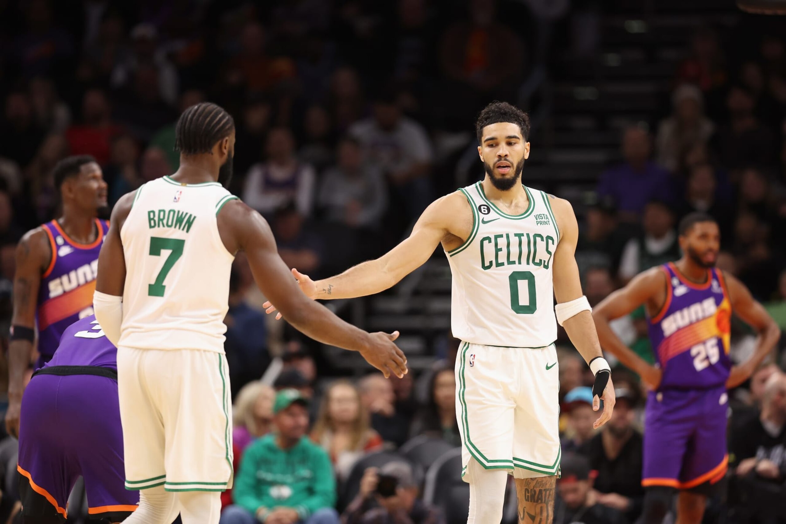 PHOENIX, ARIZONA - DECEMBER 07: Jayson Tatum #0 of the Boston Celtics high fives Jaylen Brown #7 during the second half of the NBA game at Footprint Center on December 07, 2022 in Phoenix, Arizona. NOTE TO USER: User expressly acknowledges and agrees that, by downloading and or using this photograph, User is consenting to the terms and conditions of the Getty Images License Agreement. (Photo by Christian Petersen/Getty Images)
